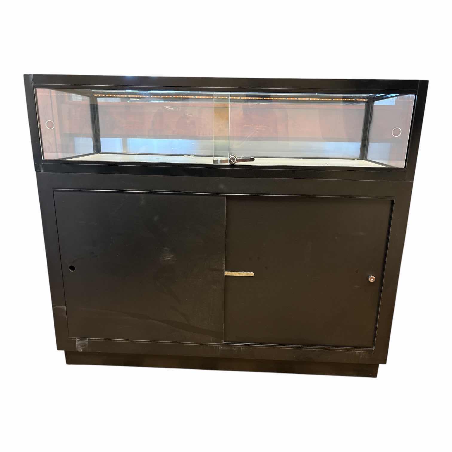 Photo 1 of QUARTER VISION BLACK GLASS DISPLAY COUNTER (SEE NOTES) 49.5”X20”H42” $757