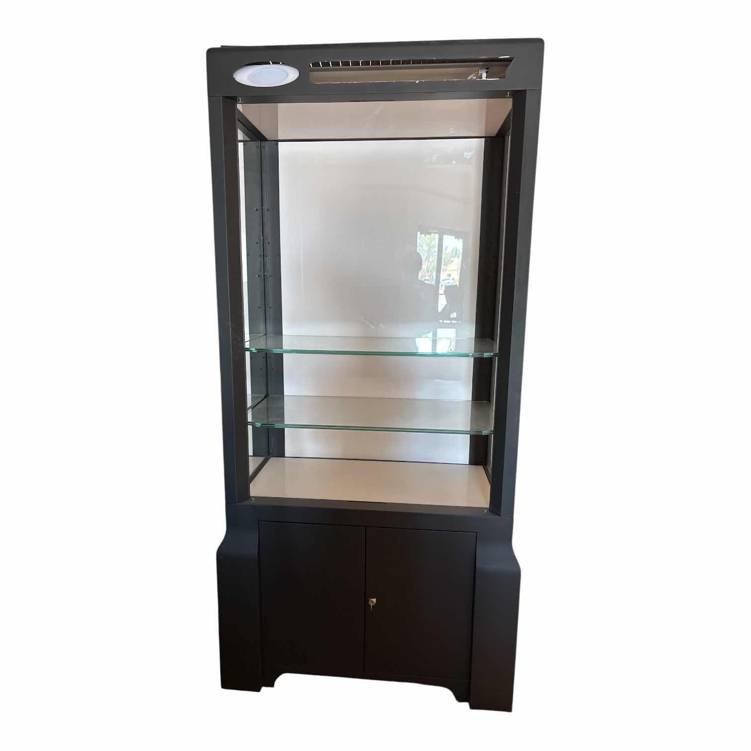 Photo 1 of OAKLEYMEGA TOWER 3.0 METAL DISPLAY CASE W/4- GLASS SHELVES COMES WITH KEY
33.5”X19”H72.5” $2900