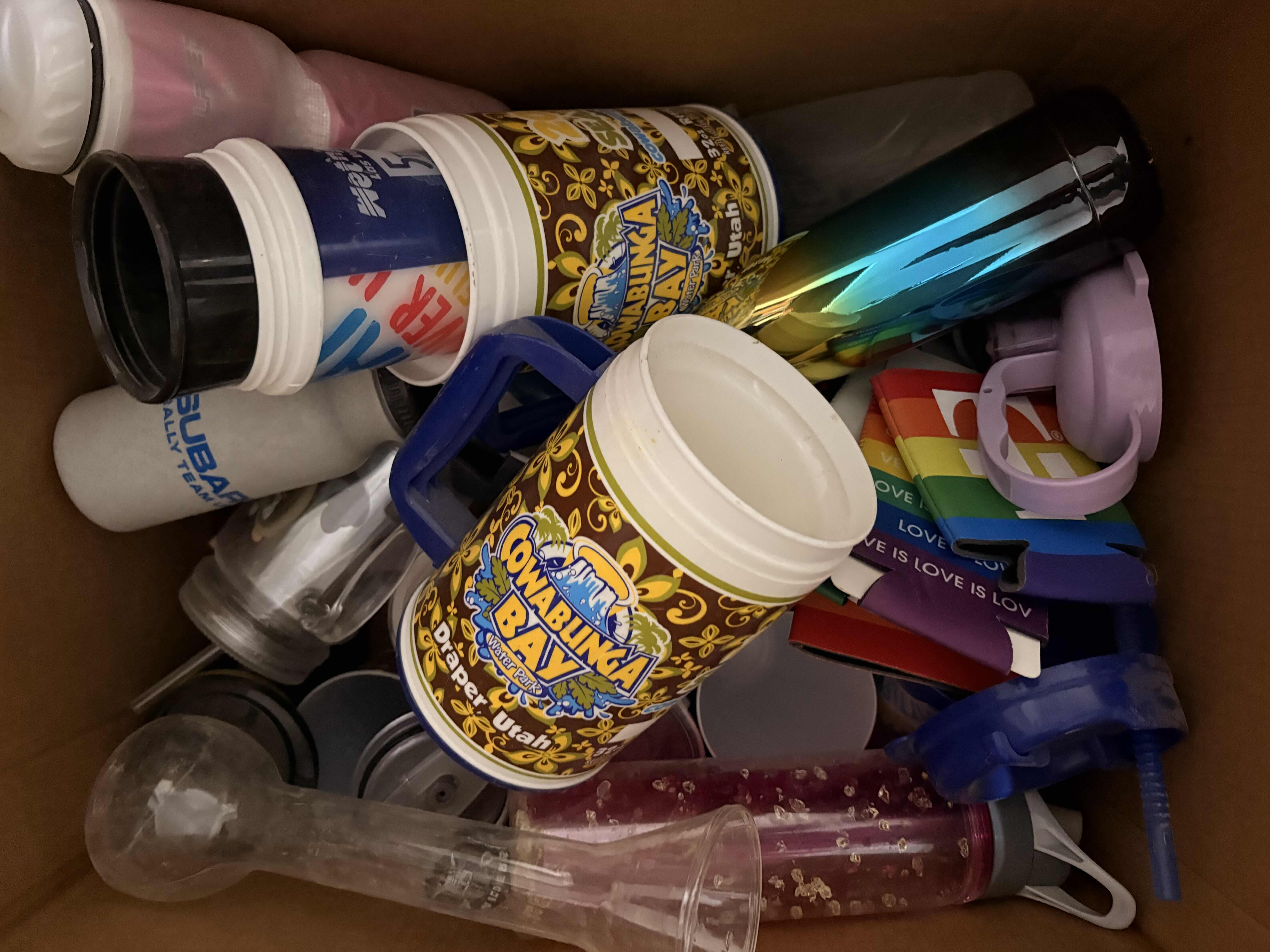 Photo 1 of BOX OF ASSORTED PLASTIC WATER BOTTLES