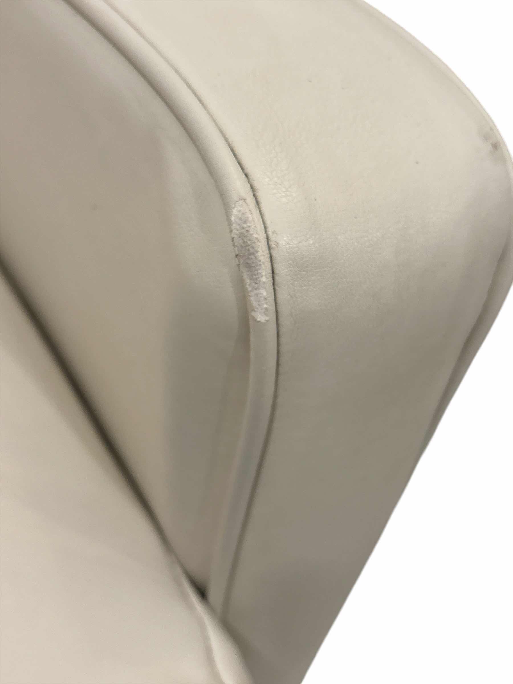 Photo 1 of CREAM FAUX LEATHER RECLINER 30” X 29” H39”
