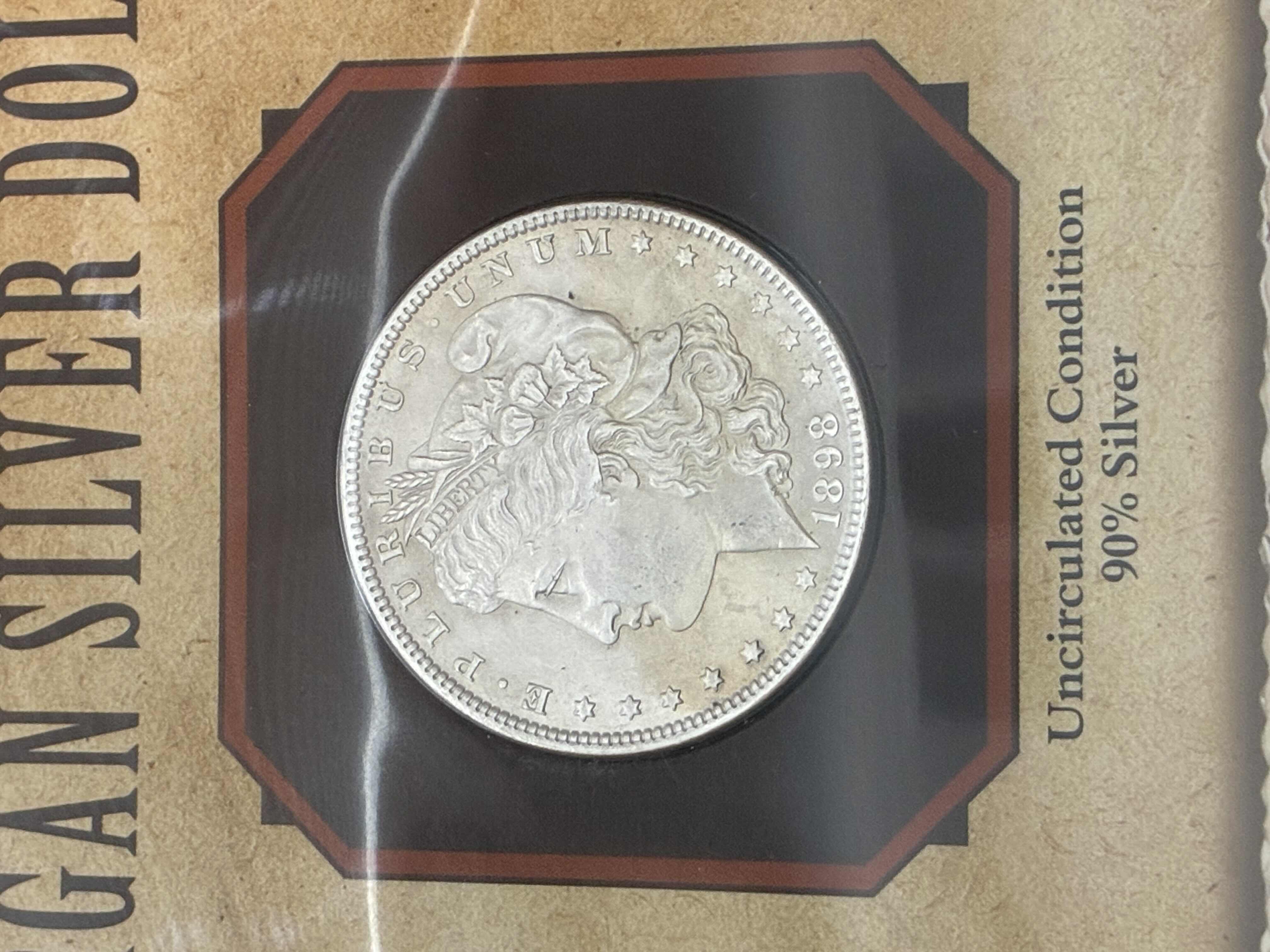 Photo 1 of UNCIRCULATED CONDITION 1898 MORGAN SILVER DOLLAR W NELLIE CASHMAN CARD & SLEEVE $300
