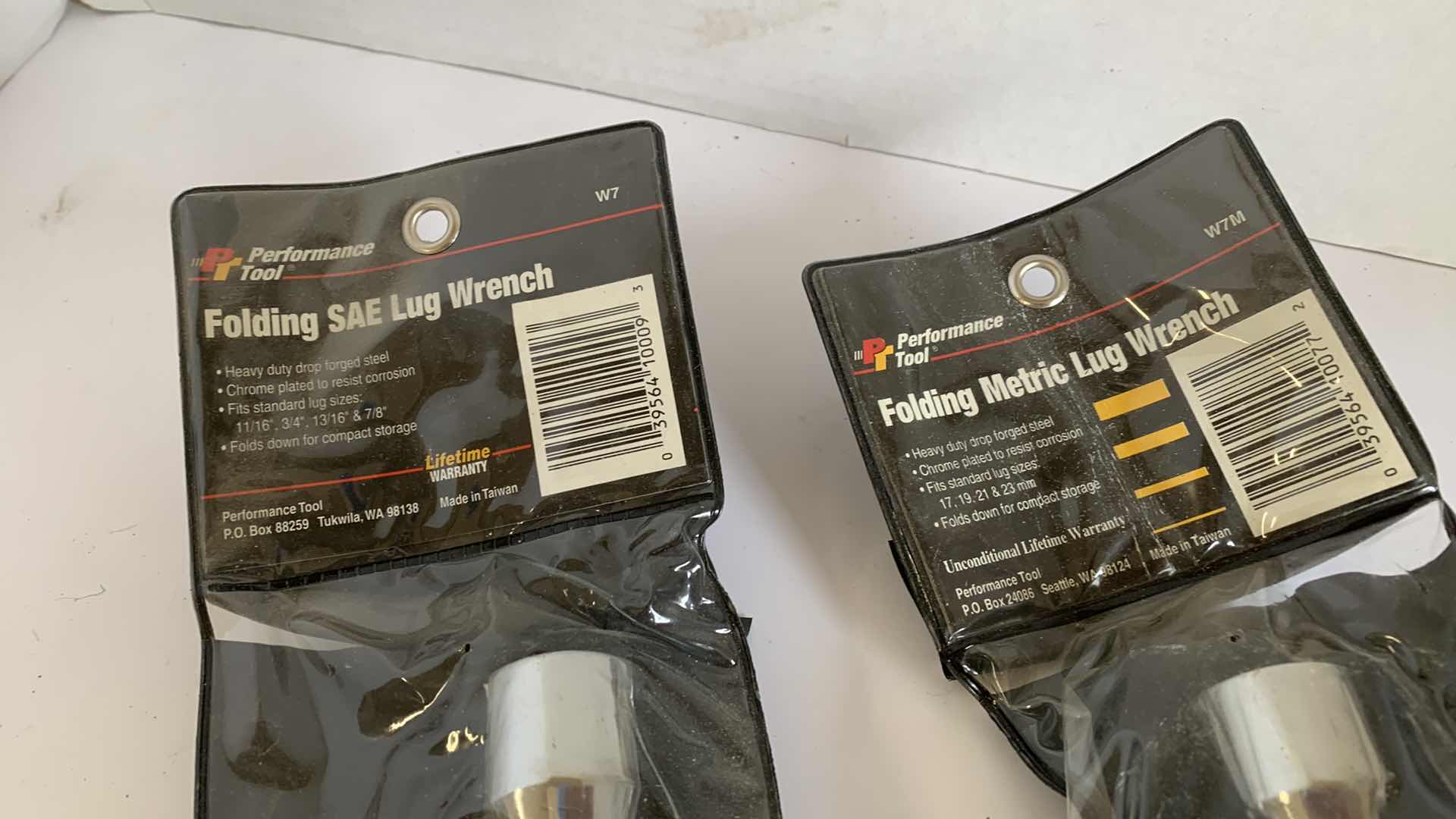 Photo 1 of 2 PERFORMANCE TOOL FOLDING SAE AND METRIC LUG WRENCHES
