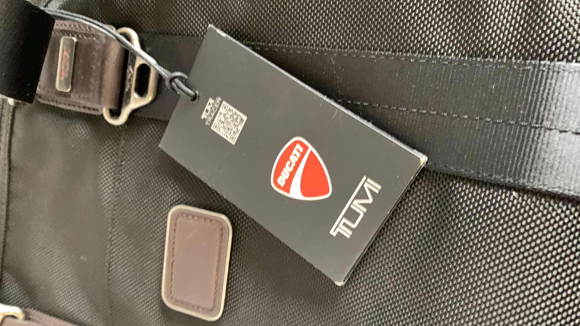 Photo 1 of *INCOMPLETE, SEE NOTES** TUMI BRONCO TOP ZIP CROSSBODY BAG