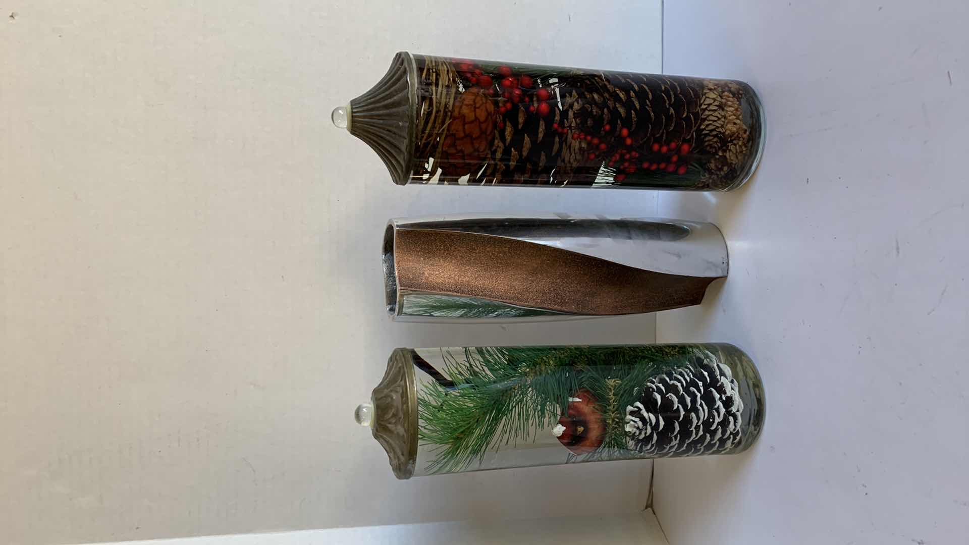 Photo 1 of 2-HOLIDAY OIL BURNING CANDLES, COPPER W SILVER VASE H13"