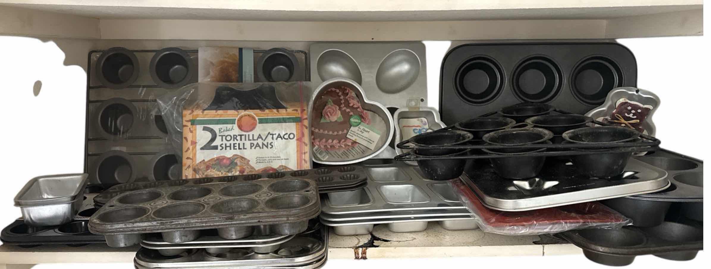 Photo 1 of CONTENTS OF SHELF  (BAKEWARE-MUFFIN PANS AND MOLDS)