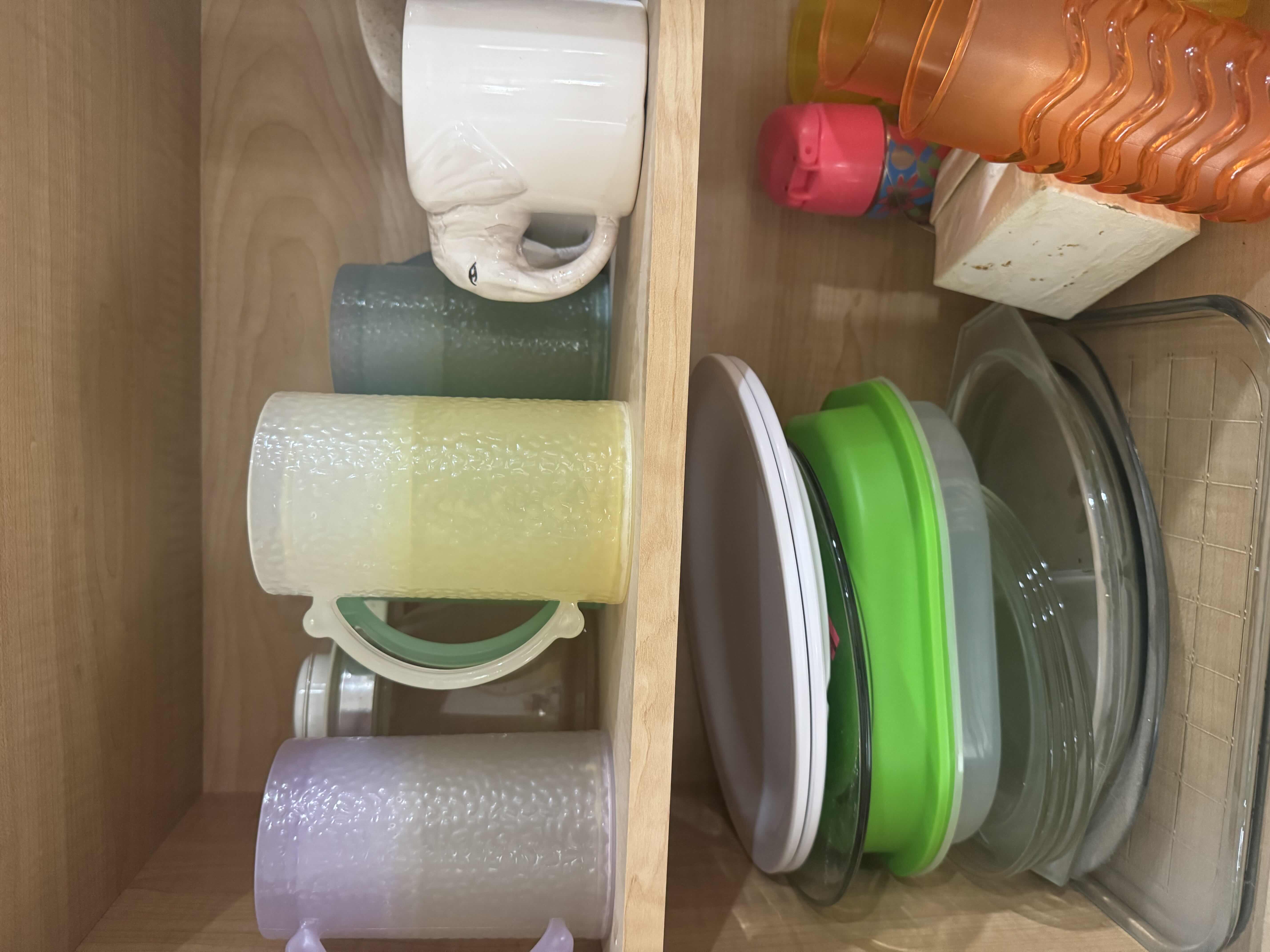 Photo 1 of CONTENTS OF CABINET- MOLDS, PITCHERS, CUPS, CARAFE, PLATTERS