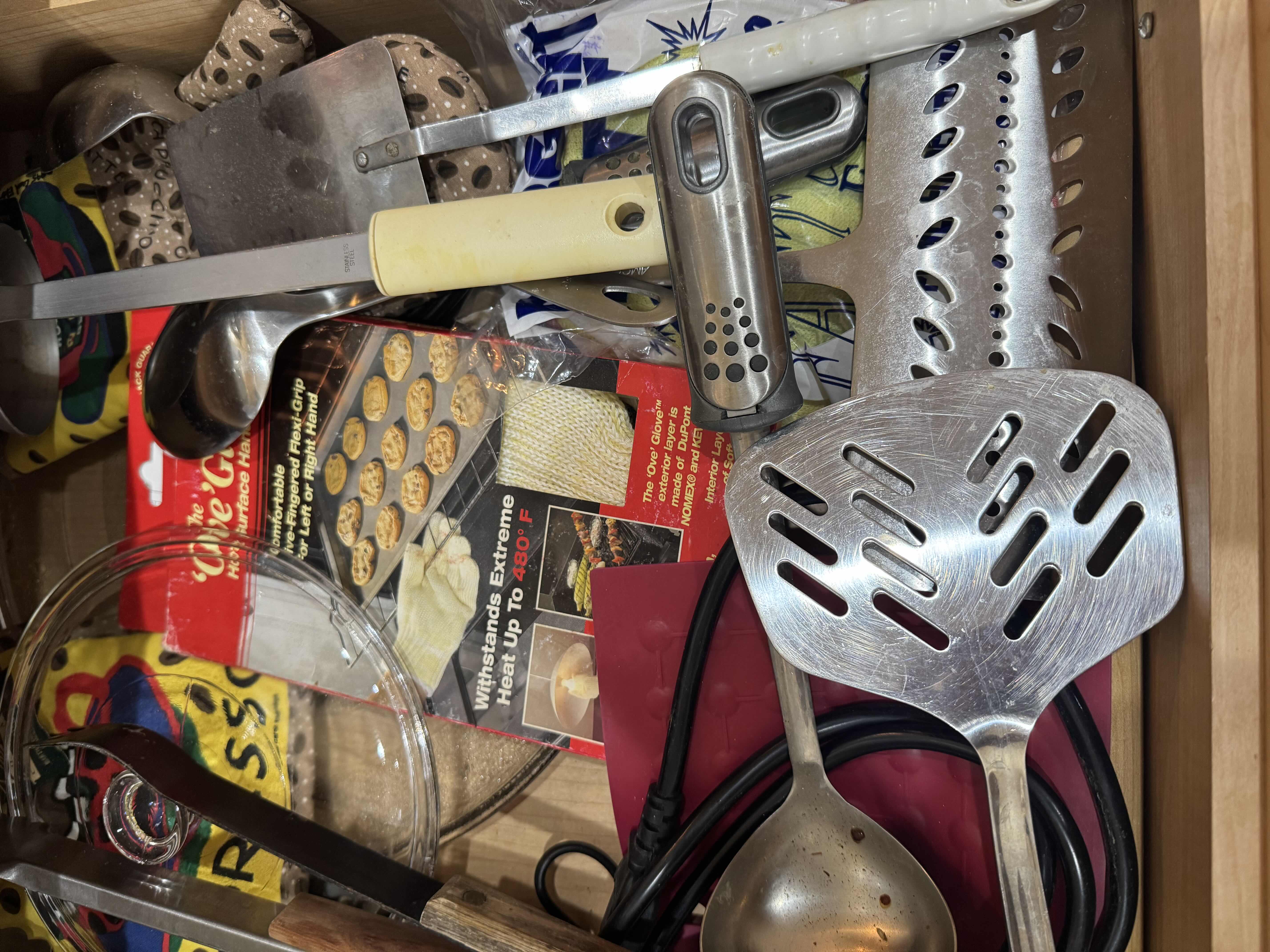 Photo 1 of CONTENTS OF DRAWER-UTENSILS HOT MATS, OVEN GLOVES