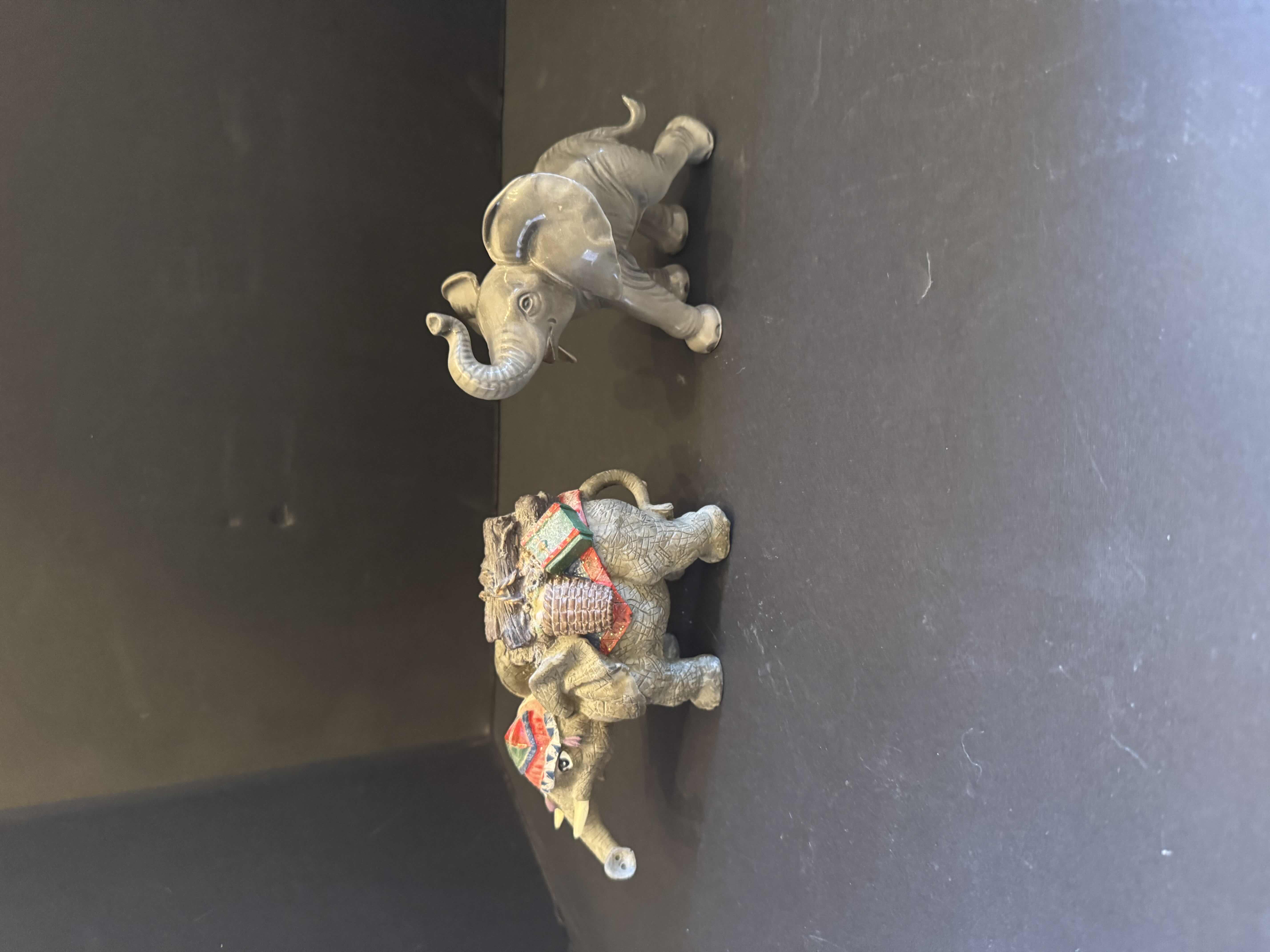 Photo 1 of 5- VINTAGE ELEPHANT FIGURINES, CERMAIC, PORCELAIN, AND RESIGN
5” X 7”H 
6”X 5”H
4.5” X 4”H
4” X 4”H 
5.5” X 4”H