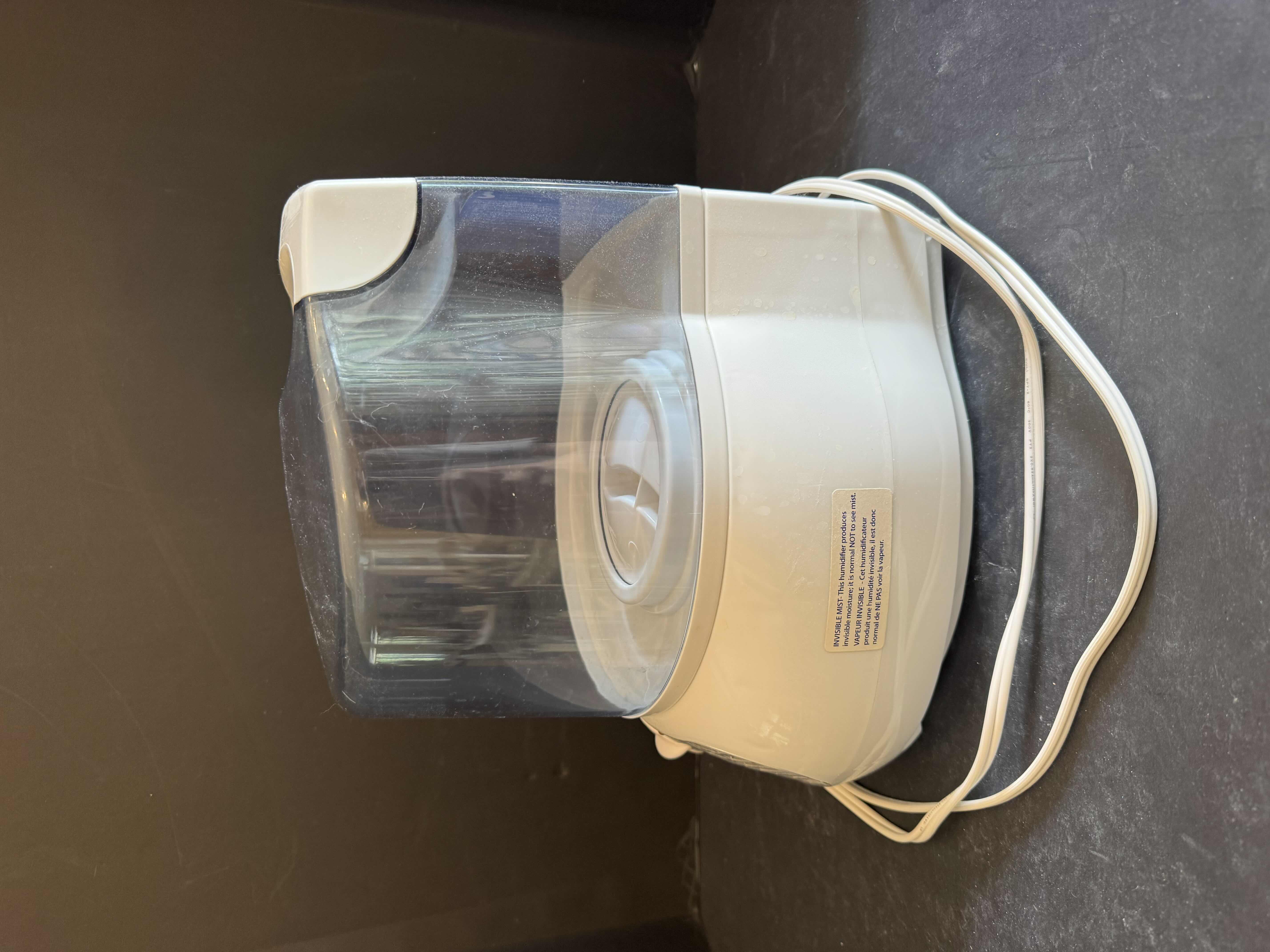Photo 1 of COOL MIST HUMIDIFIER AND 2 PORTABLE REUSABLE HEATING PAD/ COLD COMPRESS PADS, SIZE OF PADS 9.5” X H16”