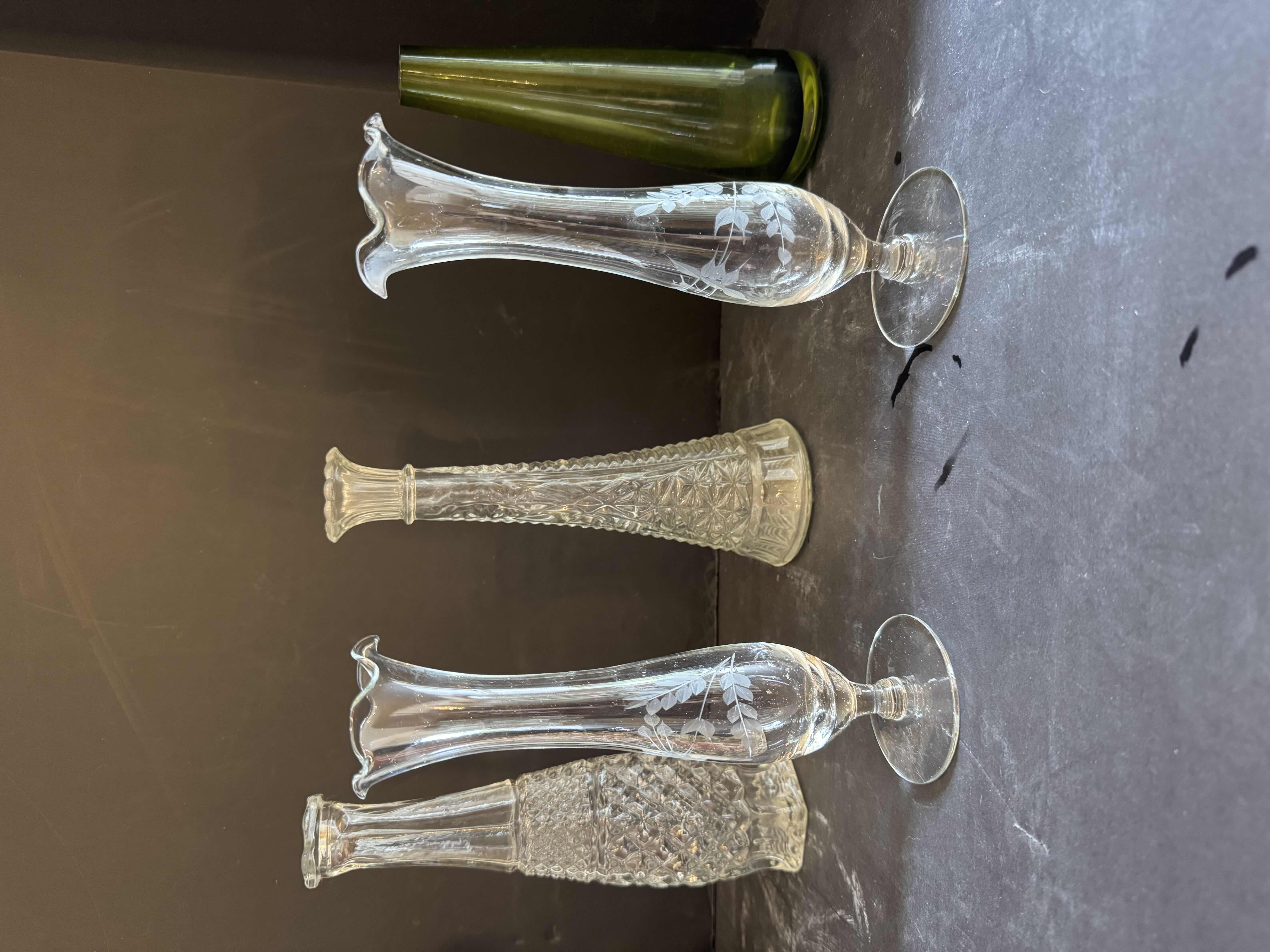 Photo 1 of ASSORTED GLASS FLOWER VASES, 7 ITEMS
ORANGE/WHITE VASE
D4.5” X H13.5”

WHITE VASE 
D5.5” X H8.5”

CLEAR VASES 
H9” AND SMALLER