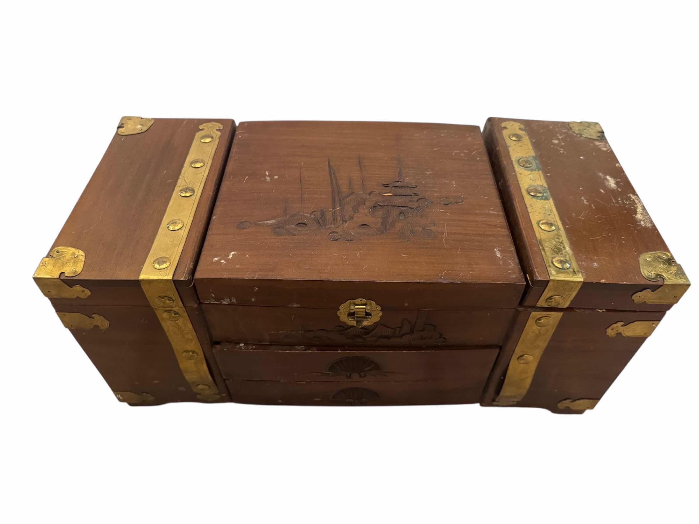 Photo 1 of 145
VINTAGE  ANTIQUE CHINESE CHIMING WOODEN CARVED JEWELRY MUSIC BOX AND WOODEN DISPLAY CABINET ITEMS INSIDE INCLUDED. 

WOODEN JEWELRY BOX
19” X 9” X H9”