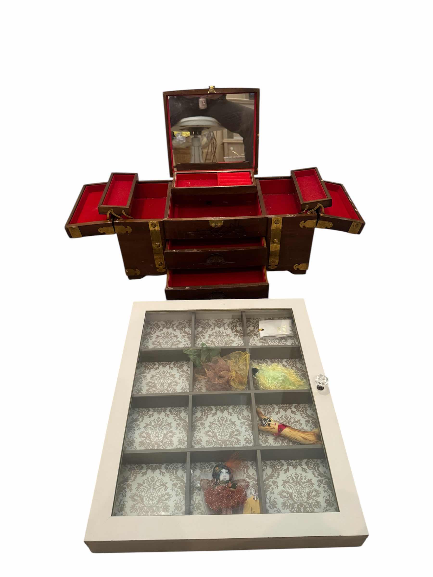 Photo 1 of 145
VINTAGE  ANTIQUE CHINESE CHIMING WOODEN CARVED JEWELRY MUSIC BOX AND WOODEN DISPLAY CABINET ITEMS INSIDE INCLUDED. 

WOODEN JEWELRY BOX
19” X 9” X H9”