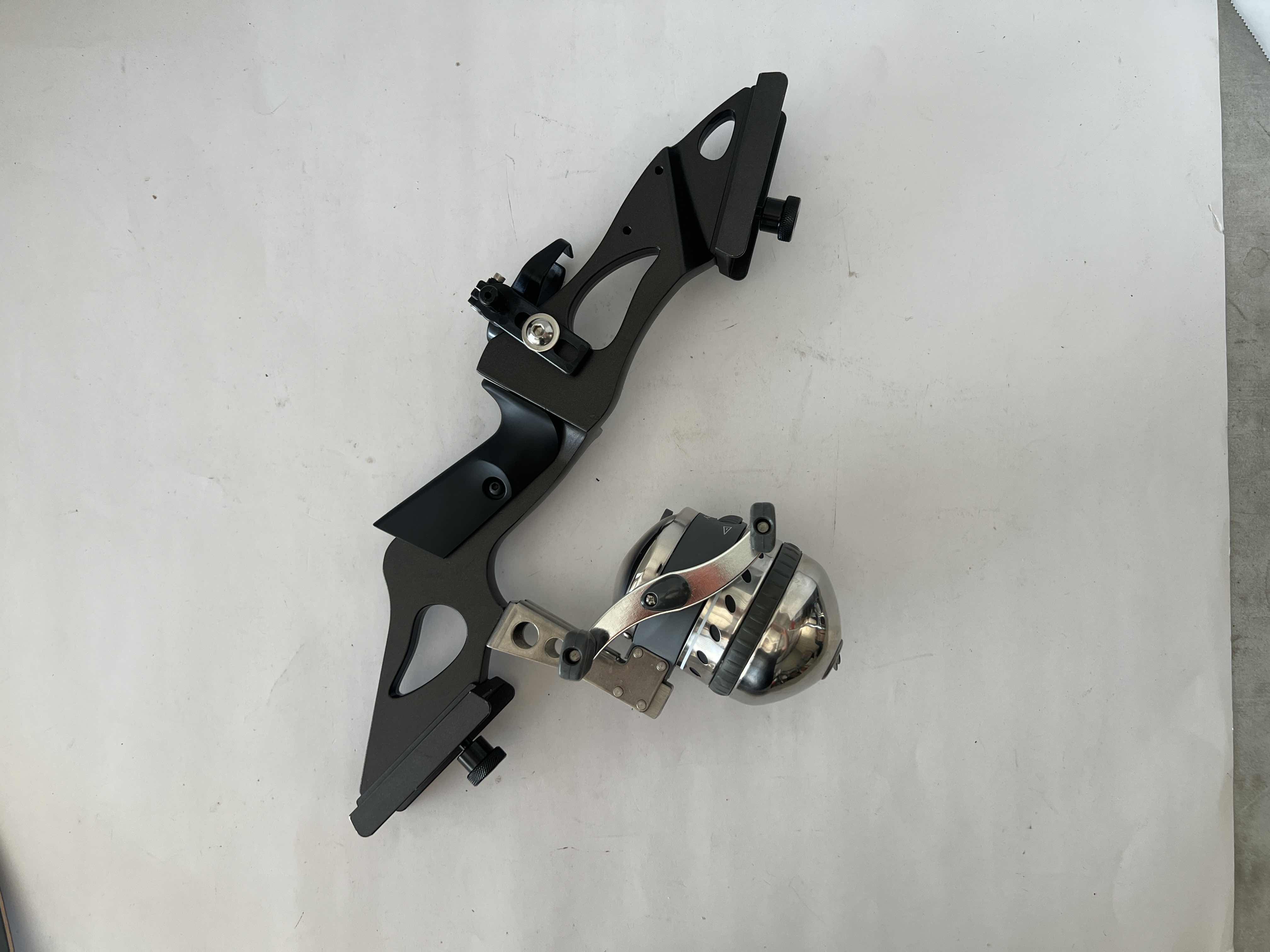 Photo 1 of MUZZY BOW FISHING KIT , INCLUDING FISHING REEL, 100 FOOT LENGTH 200 LBS TEST BOWFISHING LINE, AND RECRUVE STRING DACRON 58” AMD BOW STRINGS. TWO 32" BOWFISHING ARROWS