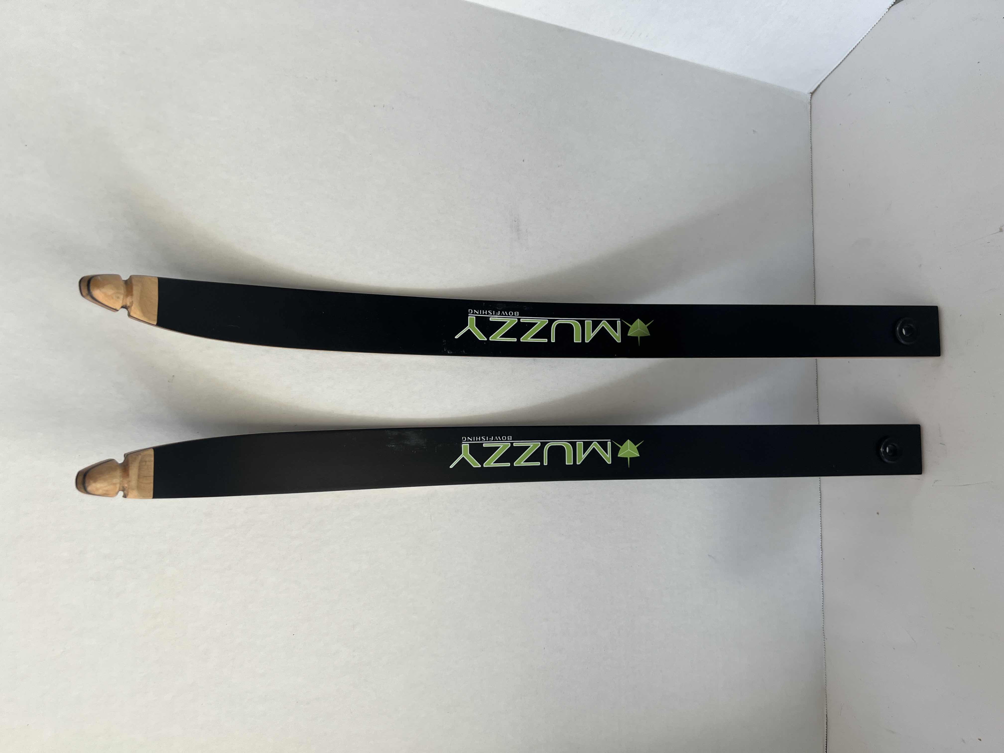 Photo 1 of MUZZY BOW FISHING KIT , INCLUDING FISHING REEL, 100 FOOT LENGTH 200 LBS TEST BOWFISHING LINE, AND RECRUVE STRING DACRON 58” AMD BOW STRINGS. TWO 32" BOWFISHING ARROWS