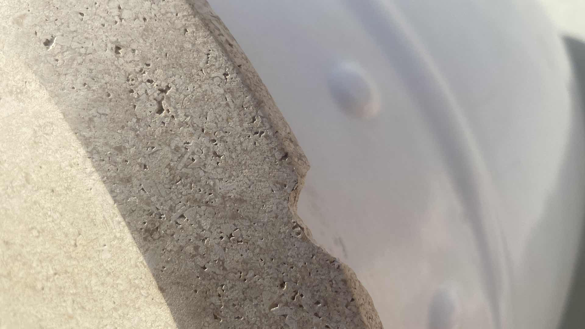 Photo 1 of ROUND OUTDOOR HEAVY END TABLE WITH STONE TOP FROM WYNN LAS VEGAS (2 AVAILABLE EACH SOLD SEPARATELY) 14 1/2” x 23”