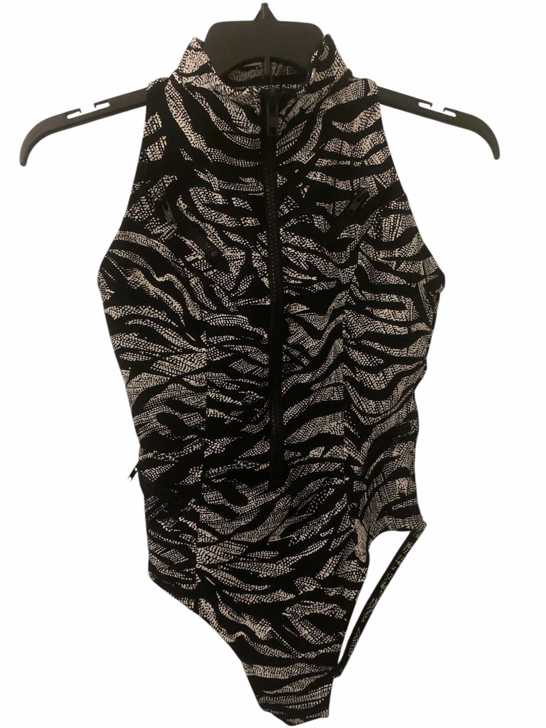 Photo 1 of WOMENS MAGIC SUIT ONE PIECE SWIM SUIT SIZE 10