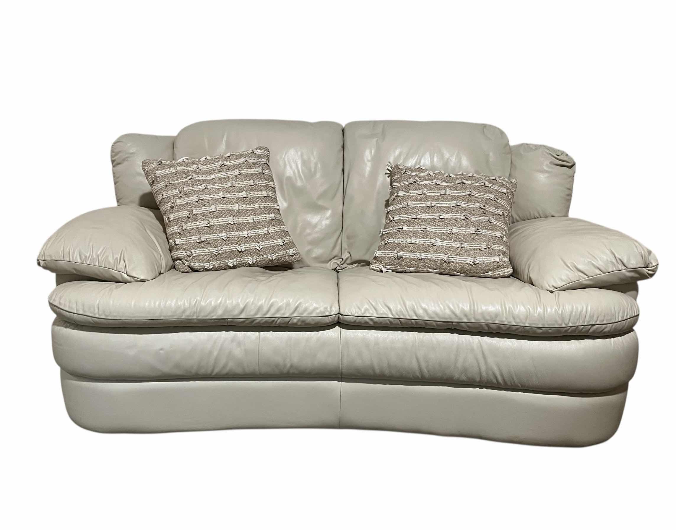 Photo 1 of ACTION INDUSTRIES OFF-WHITE LEATHER LOVESEAT W 2 THROW PILLOWS 69” X 38” H34”