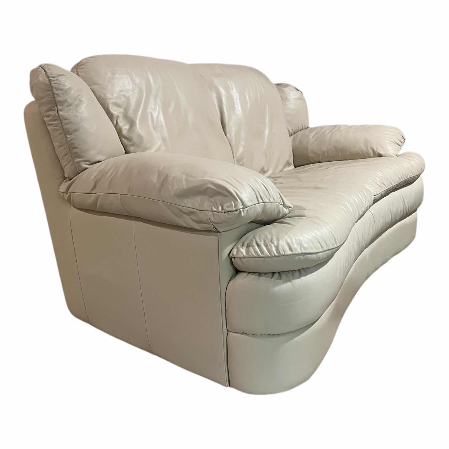 Photo 1 of ACTION INDUSTRIES OFF-WHITE LEATHER LOVESEAT W 2 THROW PILLOWS 69” X 38” H34”