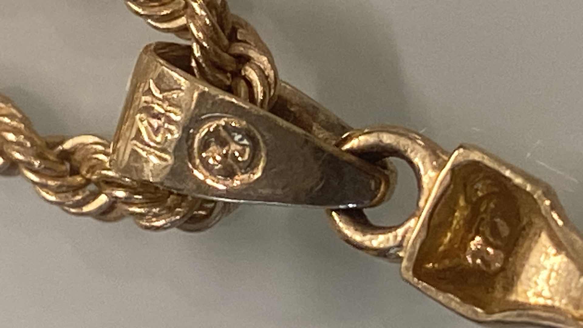 Photo 1 of WOMEN’S10K GOLD STAMPED CHAIN WITH CRUCIFIX PENDANT STAMPED 10K, 1 1/2 INCHES DROP JEWELRY