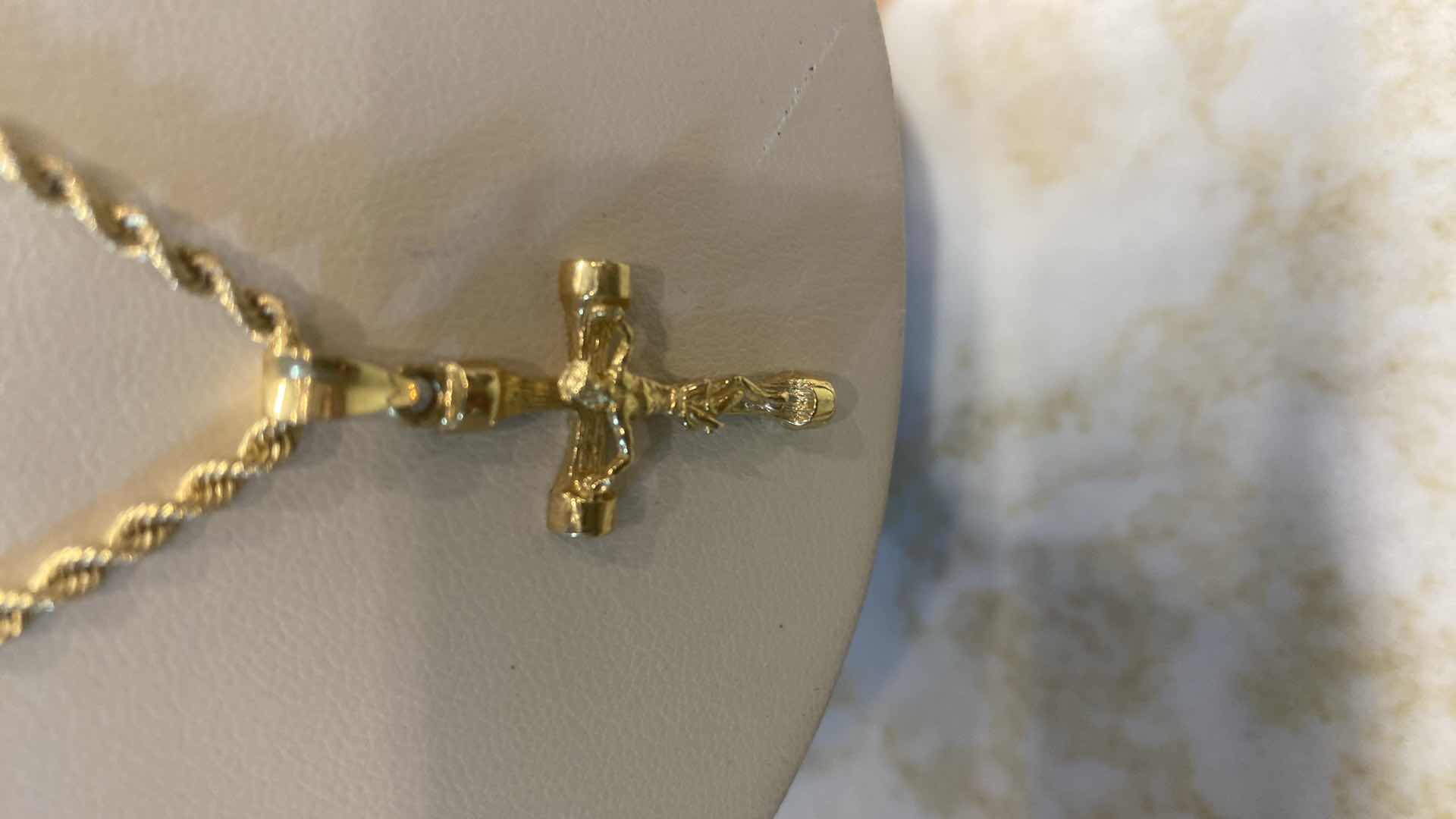 Photo 1 of WOMEN’S10K GOLD STAMPED CHAIN WITH CRUCIFIX PENDANT STAMPED 10K, 1 1/2 INCHES DROP JEWELRY