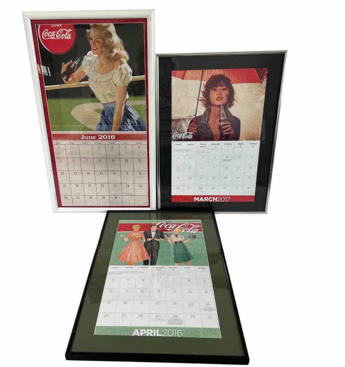 View 1 of THREE VINTAGE FRAMED COCA COLA ADVERTISING CALENDAR PAGES FROM 2016/2017
15" X 26" 15" X 21"