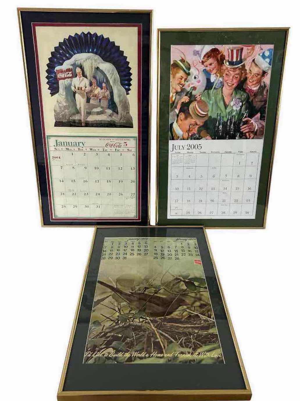 View 1 of THREE VINTAGE FRAMED COCA COLA ADVERTISING CALENDAR PAGES FROM 1973/ 2005
14" X 22" 15" X 26"