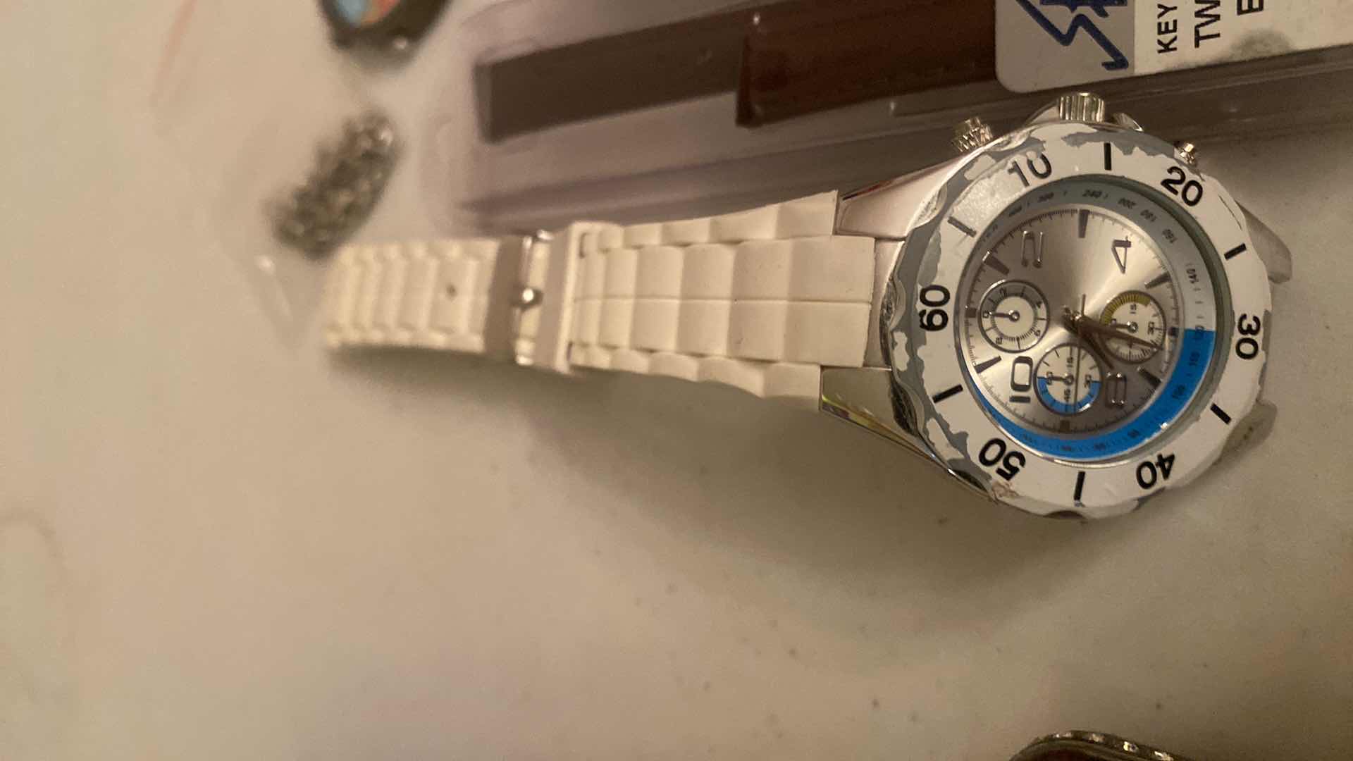View 2 of WATCH ACCESSORIES (white watch needs a new band)