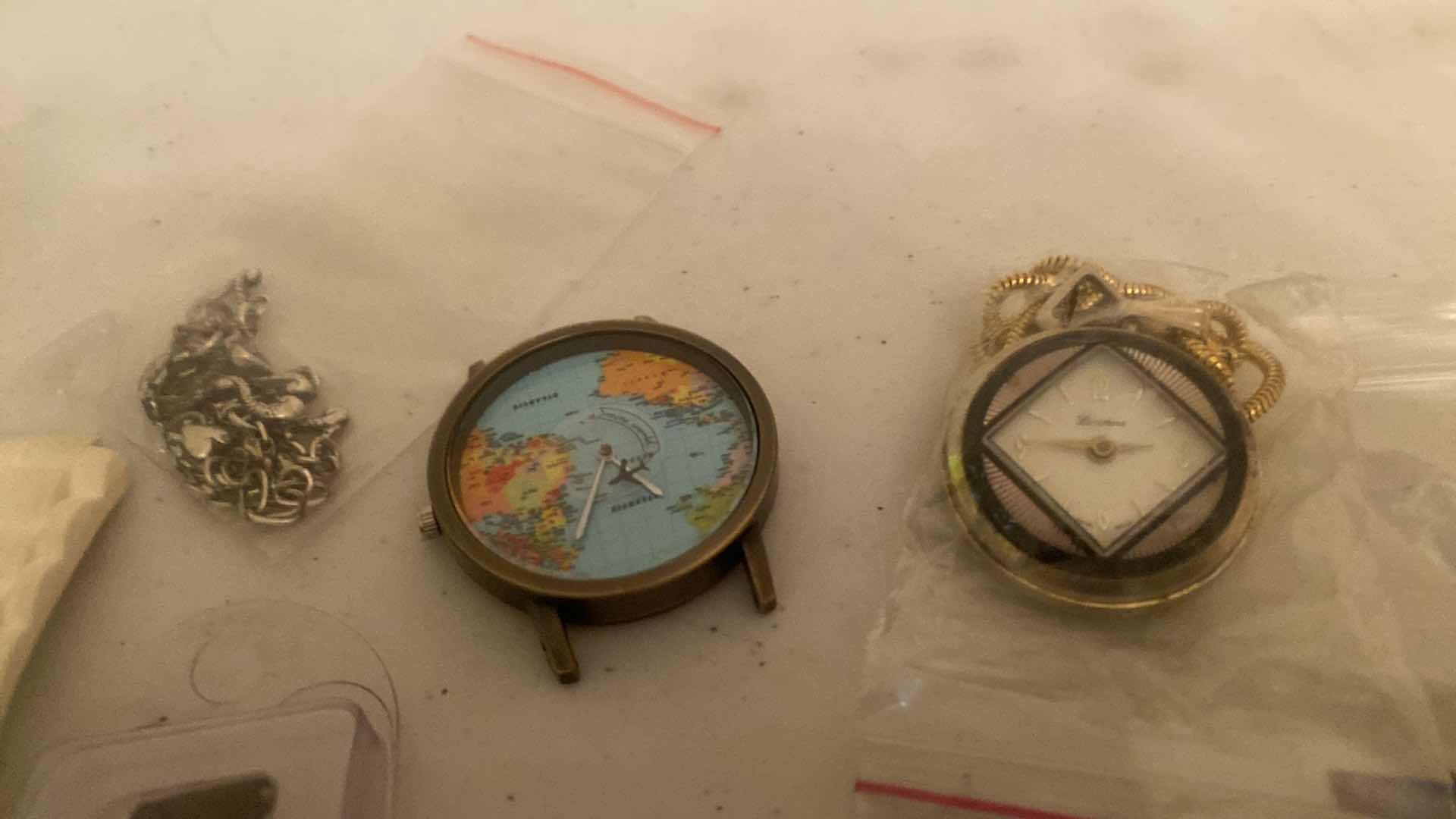 View 5 of WATCH ACCESSORIES (white watch needs a new band)