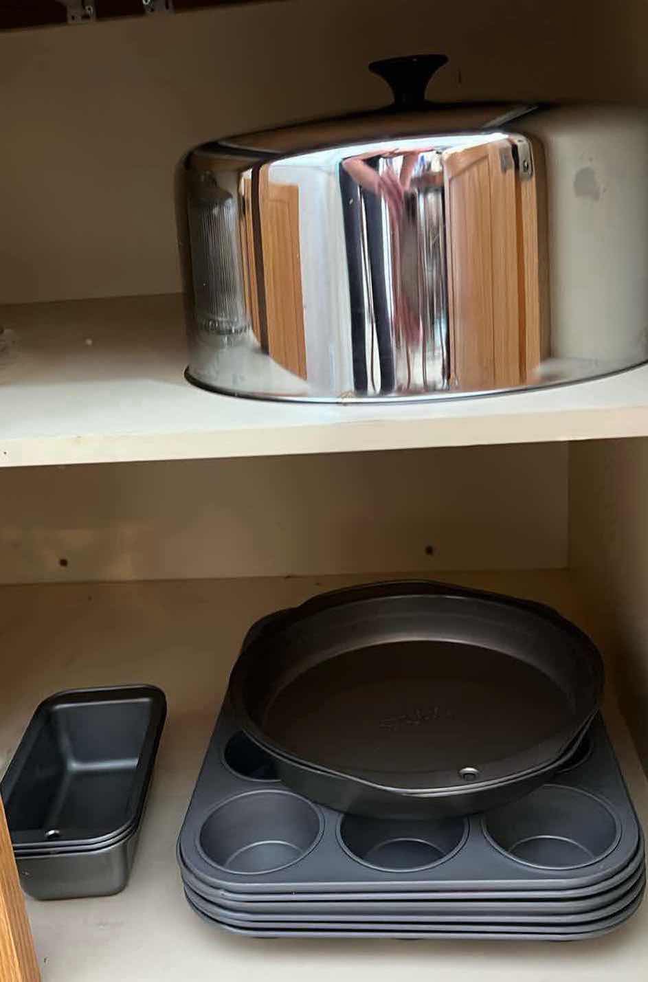 Photo 1 of CONTENTS OF KITCHEN CABINET. BAKING WARE