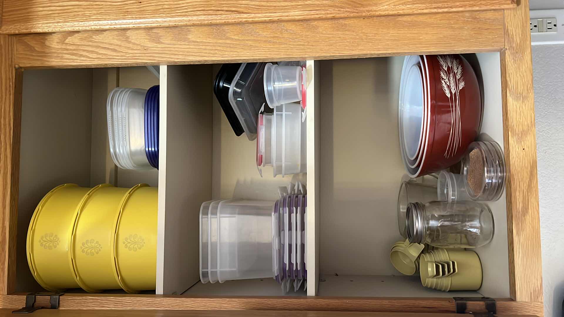 Photo 1 of CONTENTS OF KITCHEN CABINET. FOOD STORAGE AND BOWLS.