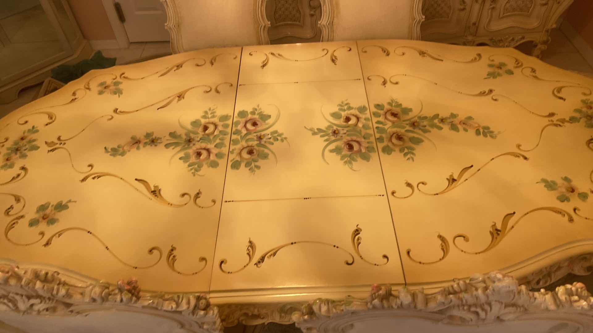 Photo 1 of FRENCH PROVINCIAL HAND PAINTED DINING TABLE W 4
ARMLESS CHAIRS & 1 ARM CHAIR MEASURES WITHOUT LEAF 67“ x 43“ H 29 3/4” LEAF 18”