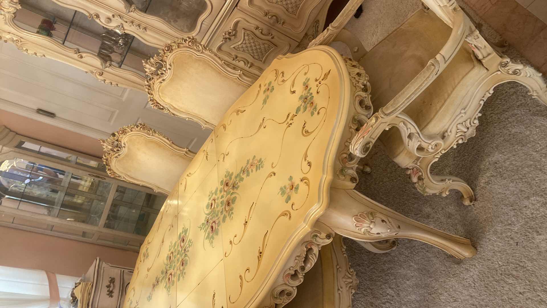 Photo 1 of FRENCH PROVINCIAL HAND PAINTED DINING TABLE W 4
ARMLESS CHAIRS & 1 ARM CHAIR MEASURES WITHOUT LEAF 67“ x 43“ H 29 3/4” LEAF 18”