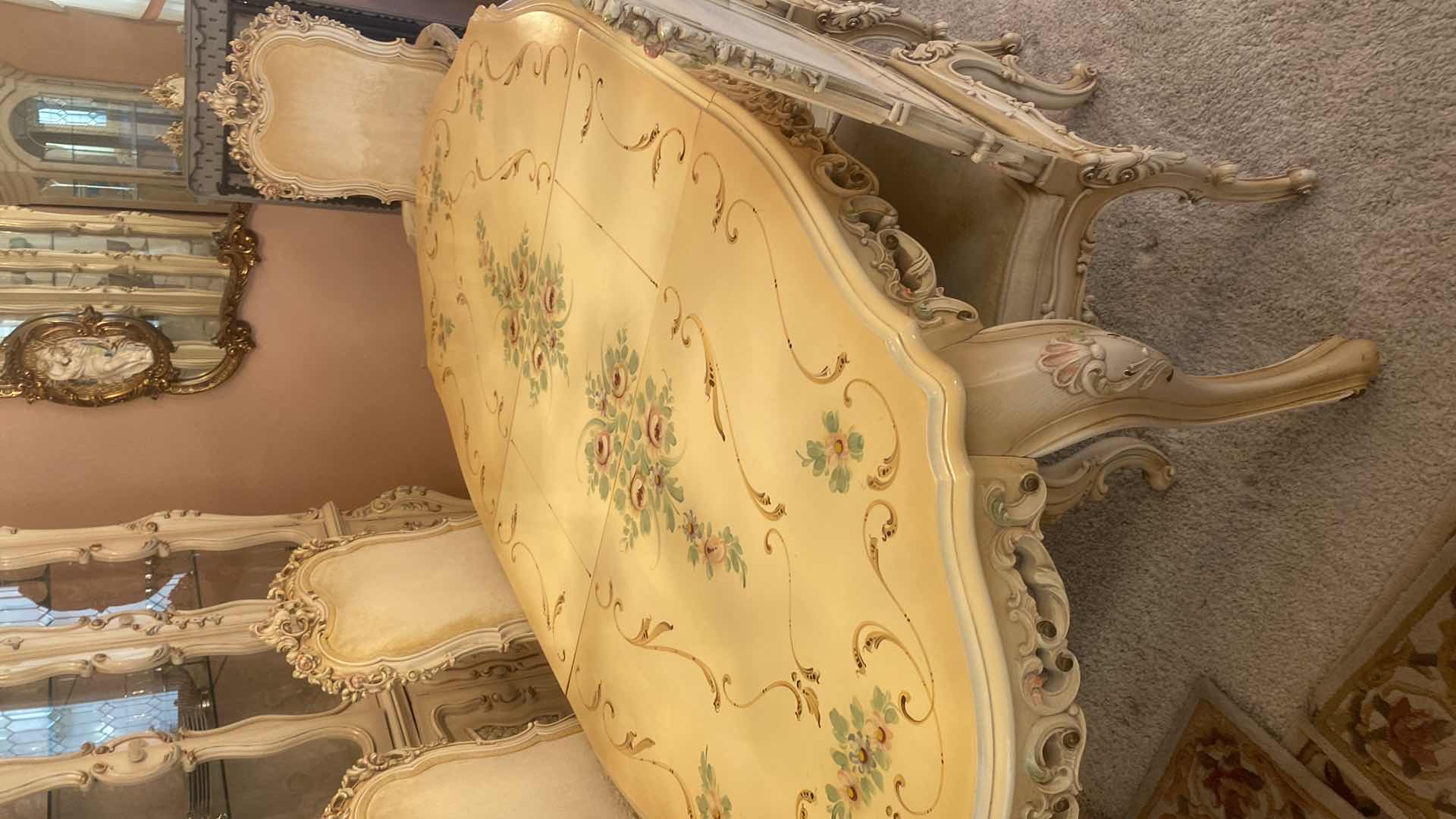 Photo 1 of FRENCH PROVINCIAL HAND PAINTED DINING TABLE W 4
ARMLESS CHAIRS & 1 ARM CHAIR MEASURES WITHOUT LEAF 67“ x 43“ H 29 3/4” LEAF 18”