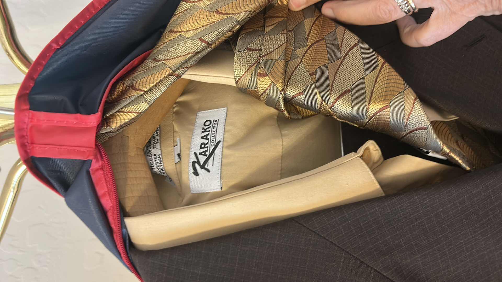 Photo 1 of MENS SUIT, SHIRT AND TIE IN ZIPPER BAG SLACKS WAIST 46”