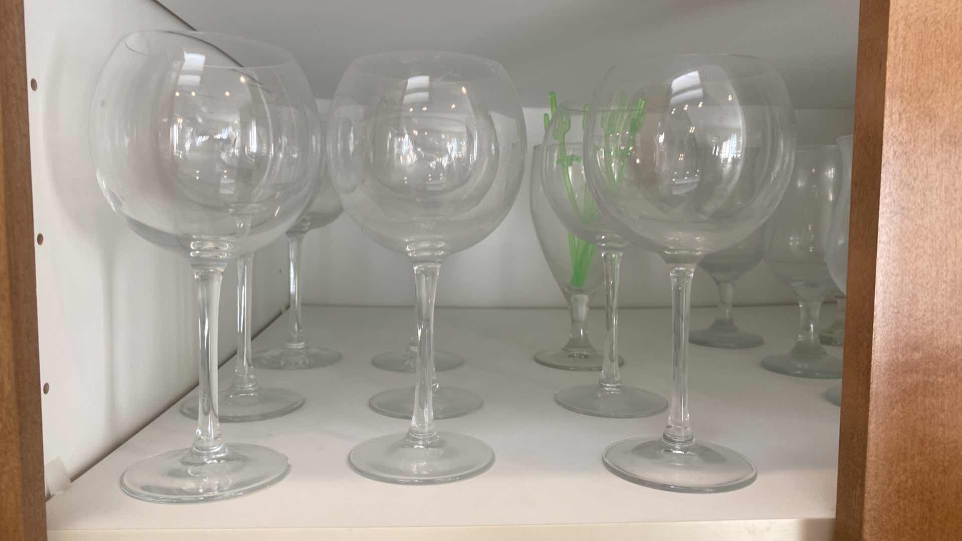 Photo 1 of CONTENTS OF CABINET - 1 SHELF MELAMINE DISHES, COFFEE CUPS, GLASSES & PITCHER, 1 SHELF STEMWARE