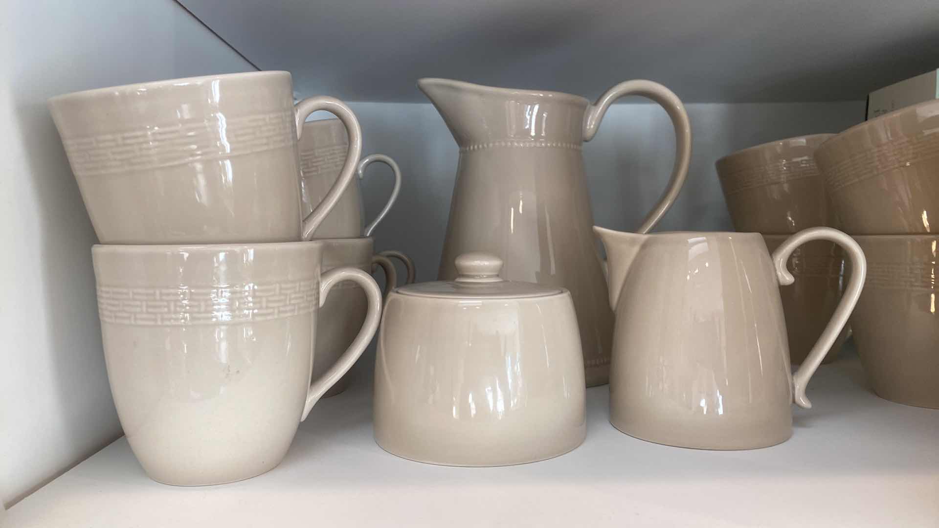 Photo 1 of CONTENTS OF CABINET - 36 PIECE MARTHA STEWART CERAMIC LUNCH SET 12 PLATES & COFFEE CUPS, PITCHER SALT PEPPER CREAM & SUGAR 1 PLATTER 5 BOWLS