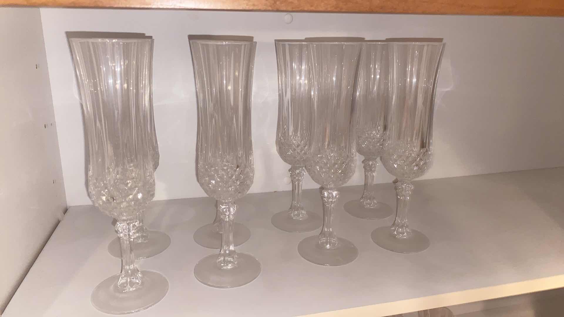 Photo 1 of CONTENTS OF CABINET - 1 SHELF LONGCHAMPS 8 CHAMPAGNE GLASSES