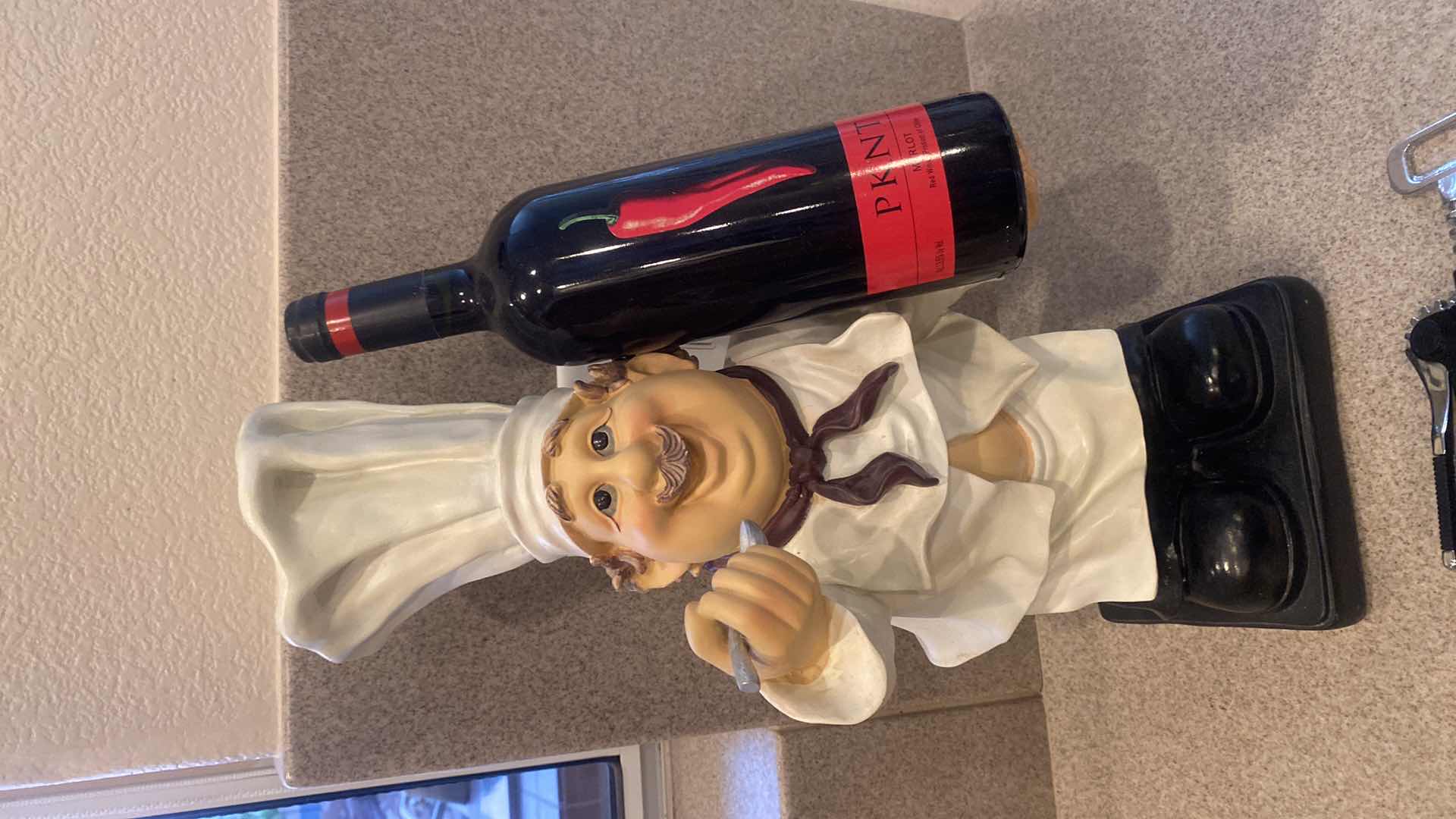 Photo 1 of RESIN CAST CHEF WINE HOLDER WITH WINE OPENER (wine not included) H18”