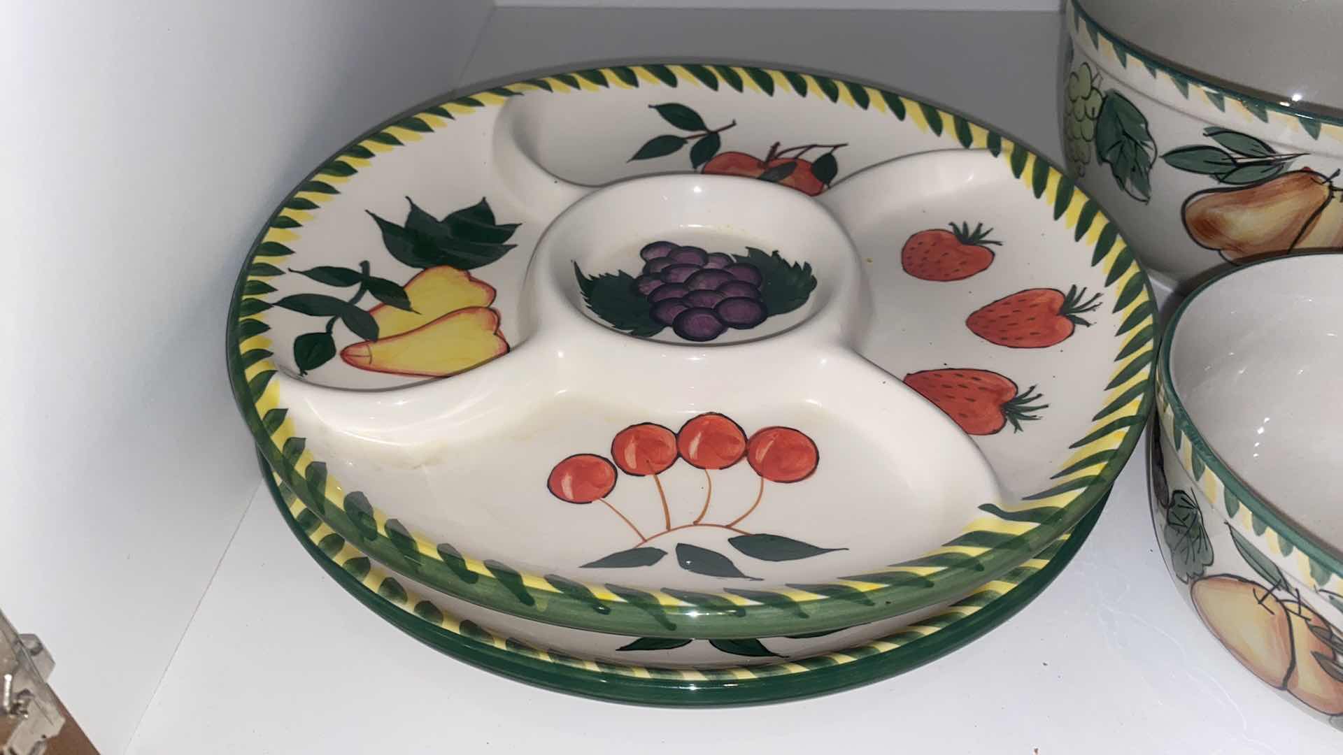 Photo 1 of CONTENTS OF CABINET - MELAMINE SUNFLOWER SERVE WARE & CERAMIC FRUIT MOTIF SERVE WARE