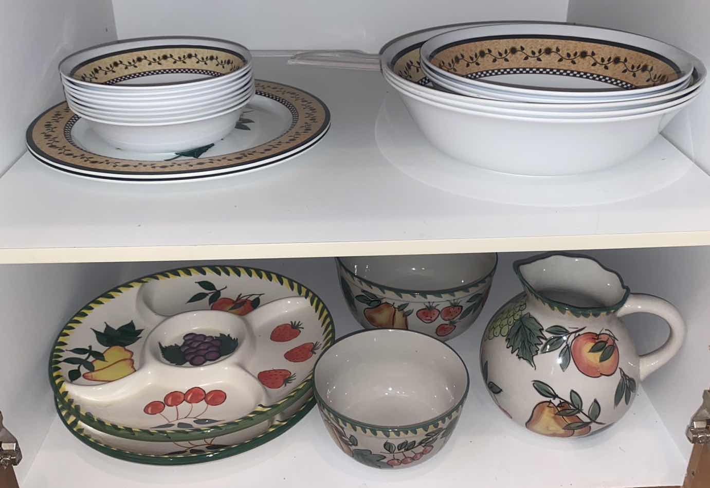 Photo 1 of CONTENTS OF CABINET - MELAMINE SUNFLOWER SERVE WARE & CERAMIC FRUIT MOTIF SERVE WARE