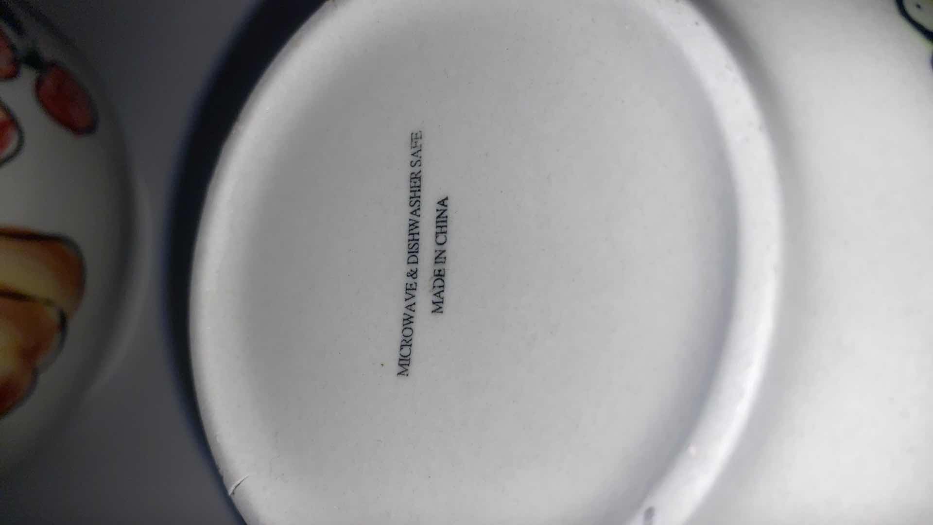 Photo 1 of CONTENTS OF CABINET - MELAMINE SUNFLOWER SERVE WARE & CERAMIC FRUIT MOTIF SERVE WARE