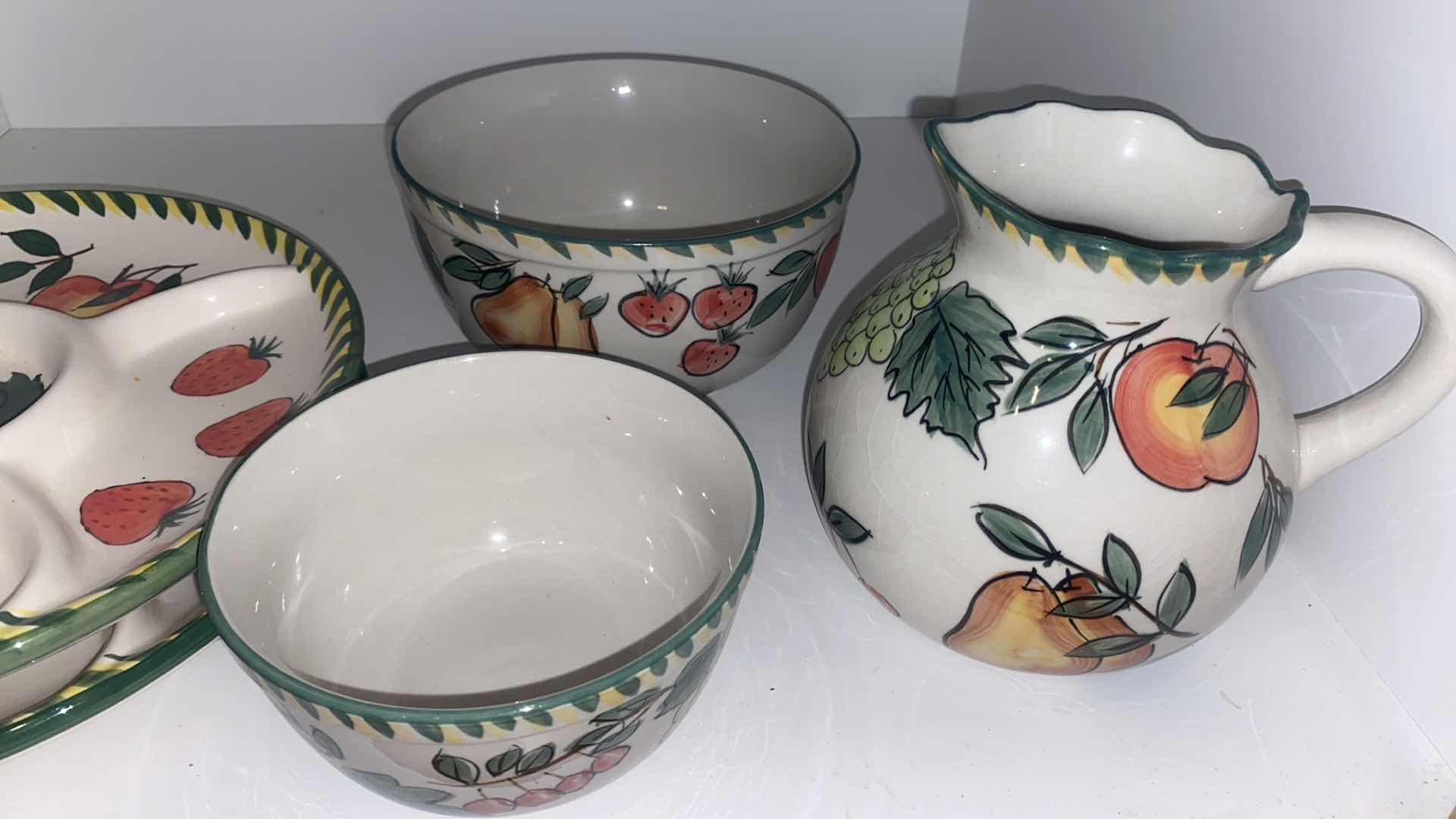 Photo 1 of CONTENTS OF CABINET - MELAMINE SUNFLOWER SERVE WARE & CERAMIC FRUIT MOTIF SERVE WARE