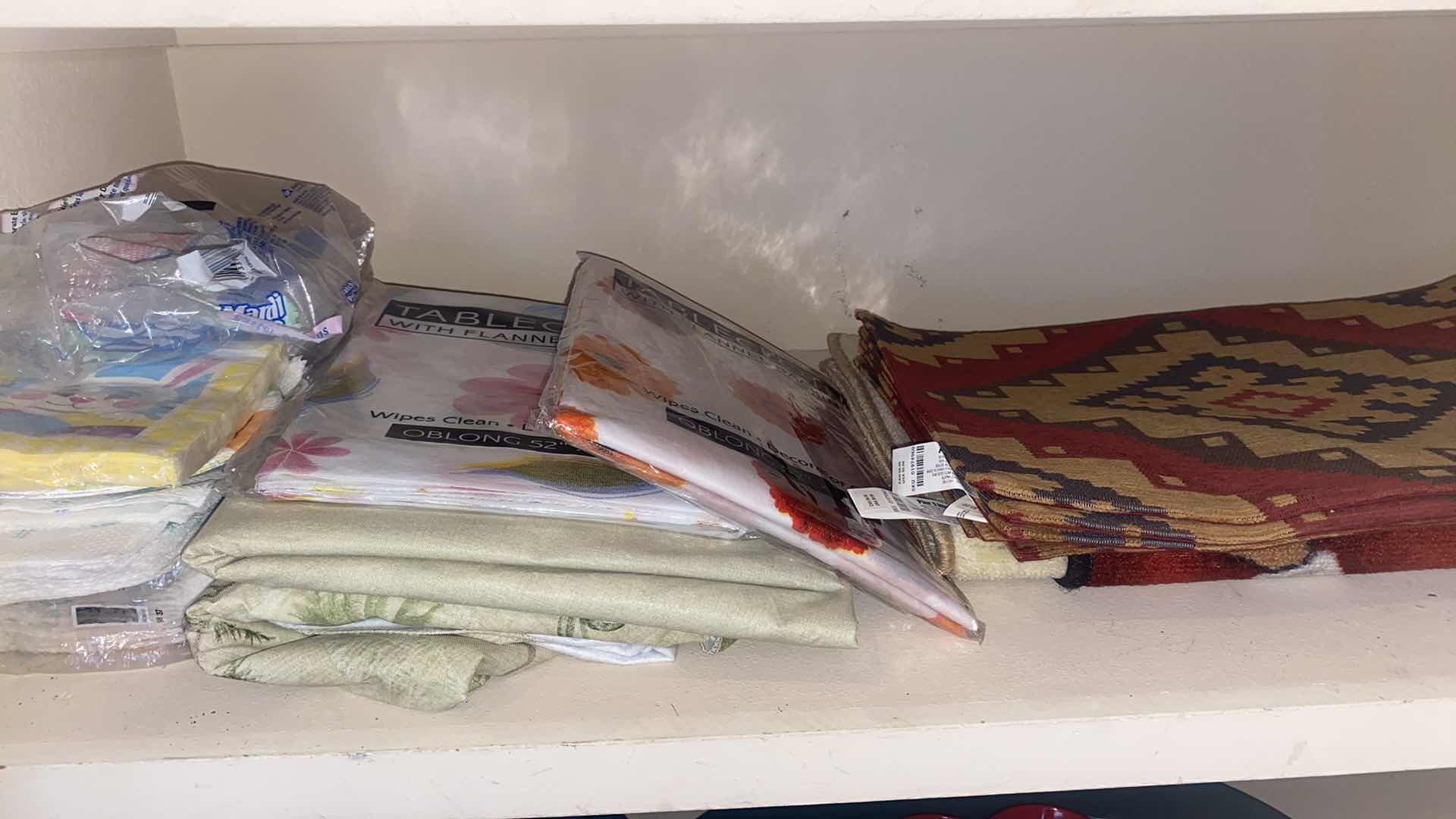 Photo 1 of CONTENTS OF CLOSET - KITCHEN PAPER BOWLS, PLASTIC STORAGE, NAPKINS TABLECLOTHS & METAL FRUIT BOWL & NAPKIN HOLDERS