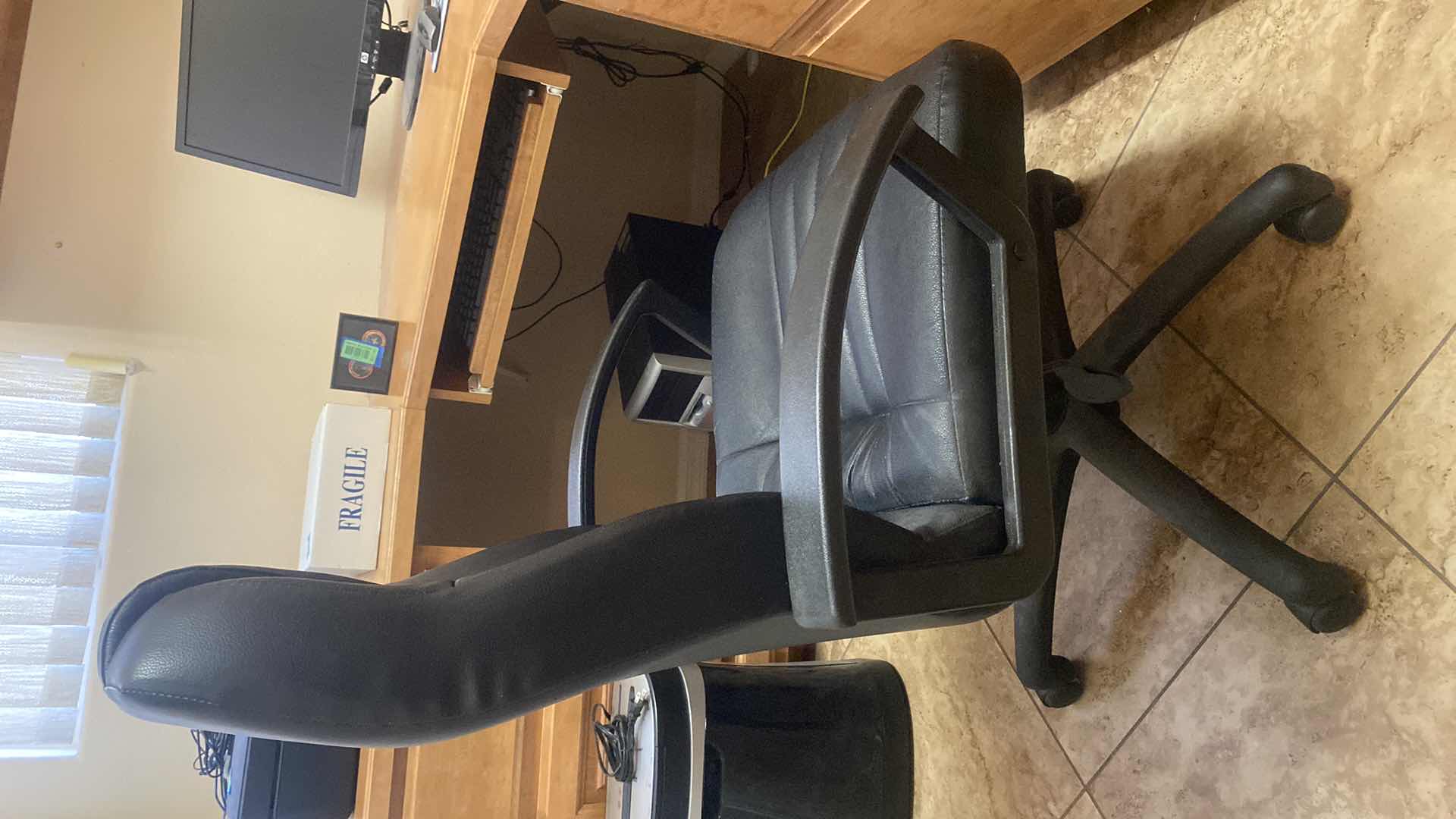 Photo 1 of BLACK BONDED LEATHER OFFICE CHAIR WITH WHEELS