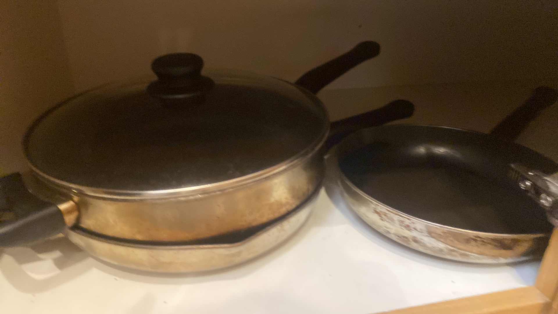 Photo 1 of CONTENTS OF CABINET- ULTREX POTS & PANS 8 PC SET