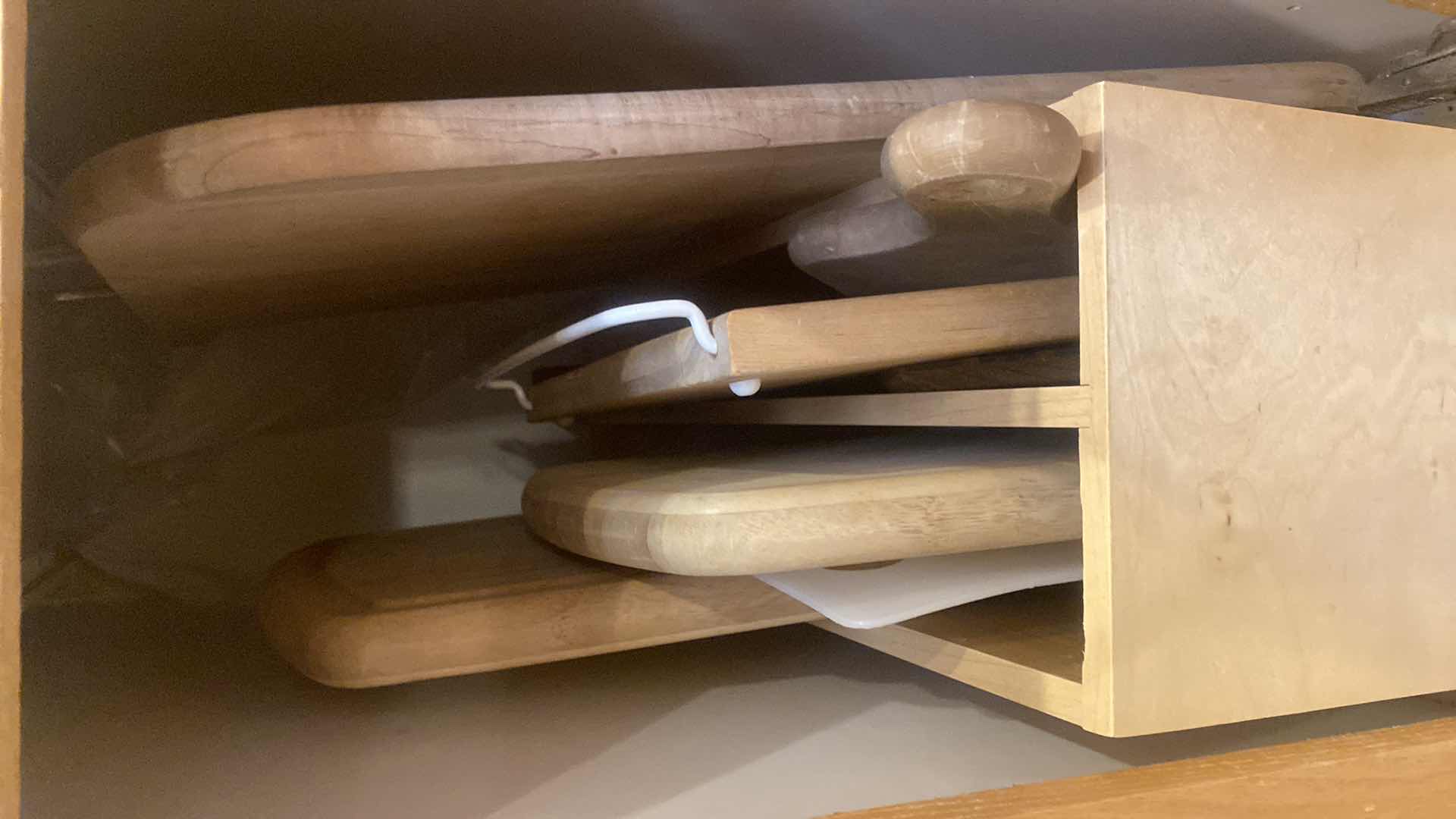 Photo 1 of CONTENTS OF CABINET-CUTTING BOARDS (holder not included)