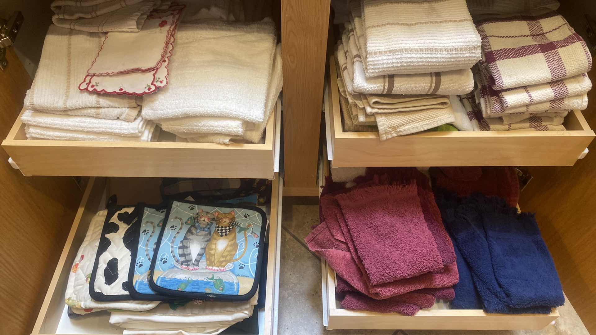 Photo 1 of CONTENTS OF CABINET-DISH TOWELS & POT HOLDERS