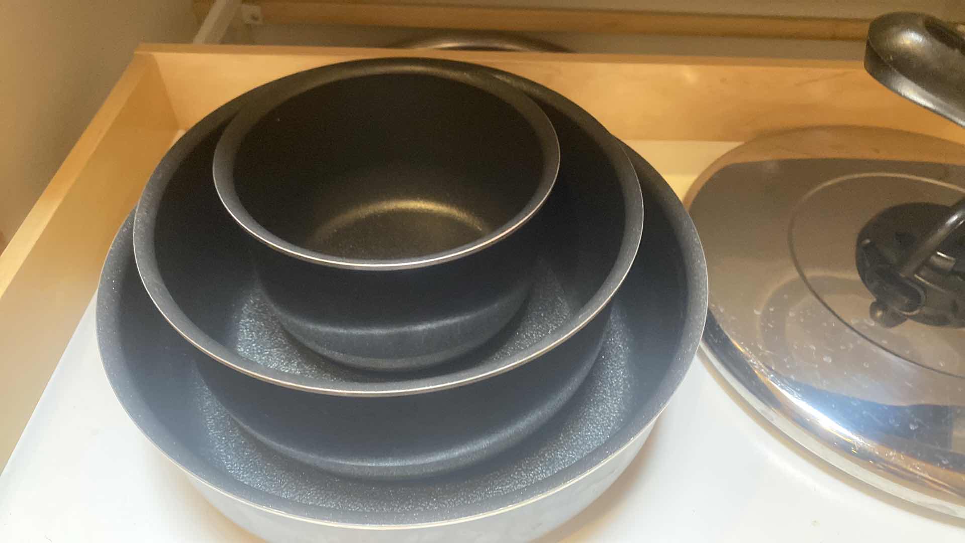 Photo 1 of CONTENTS OF CABINET-T FAL POTS AND PANS