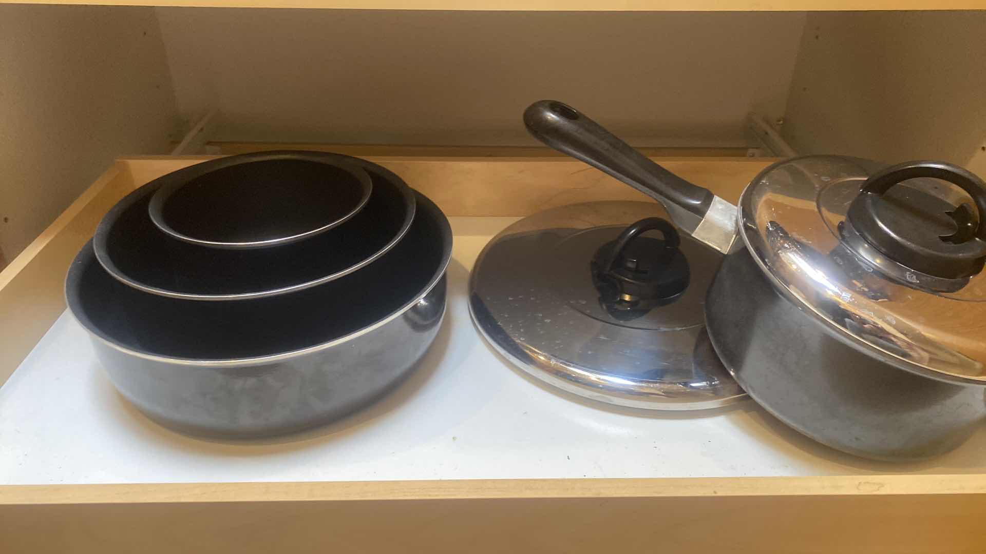 Photo 1 of CONTENTS OF CABINET-T FAL POTS AND PANS