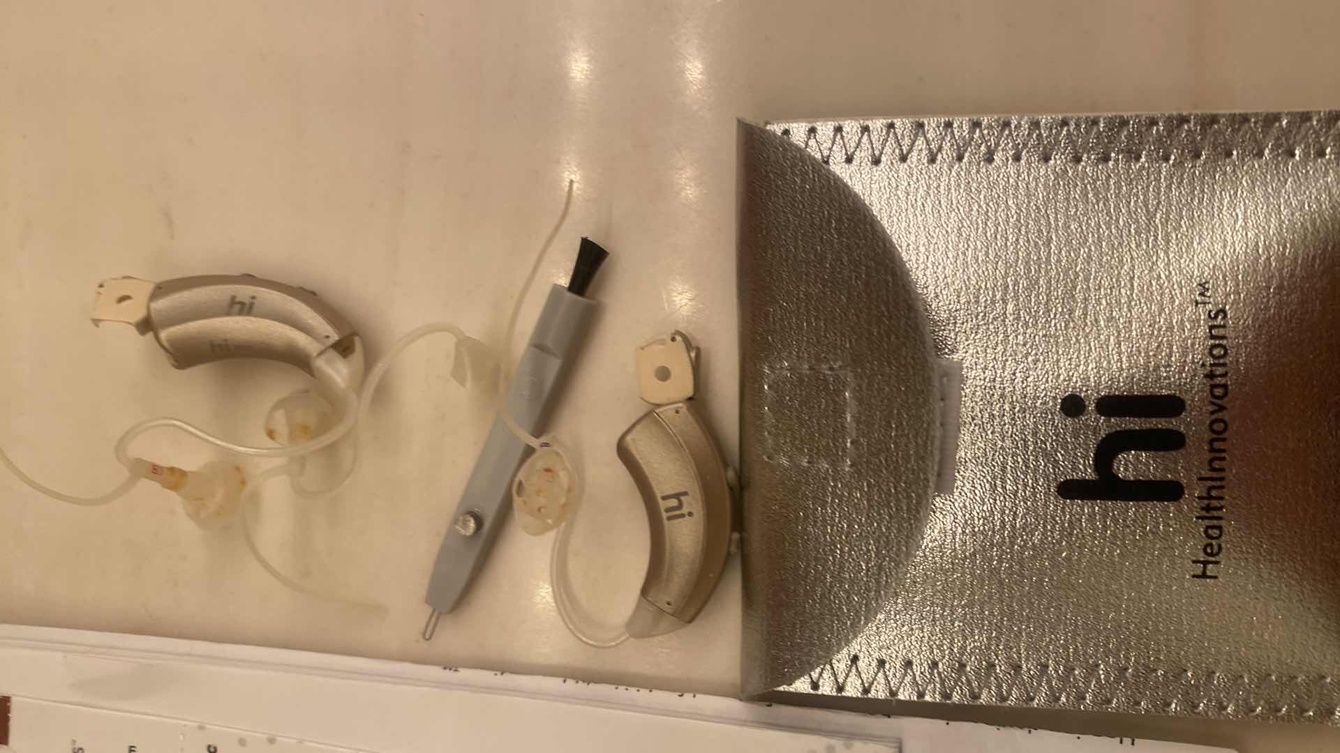 Photo 1 of HI HEARING AIDS WITH BATTERIES & BOOKLET EST VALUE $330.00